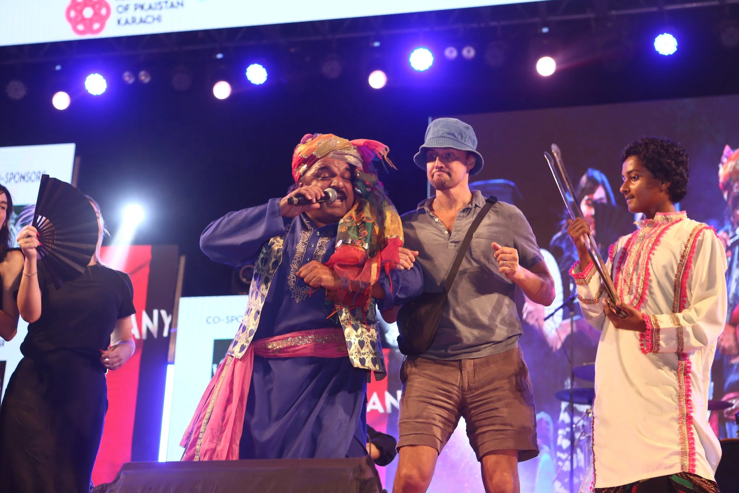 Alex Liu dances on stage at Mega Music Concert 2.0, Karachi, Pakistan, October 2024