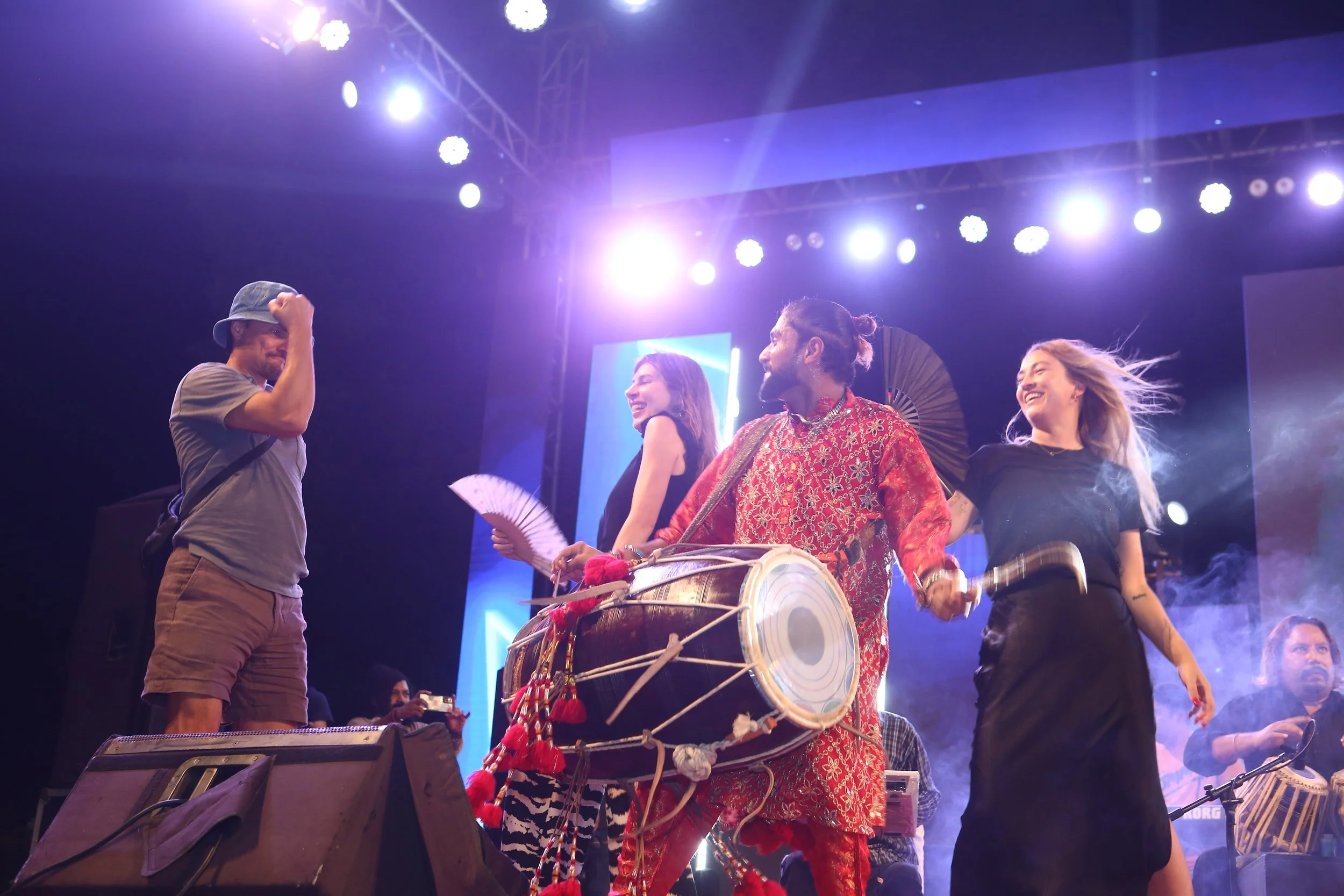 Alex Liu, Bonnie J. Evans, and Sarah Dillamore dance on stage at Mega Music Concert 2.0, Karachi, Pakistan, October 2024