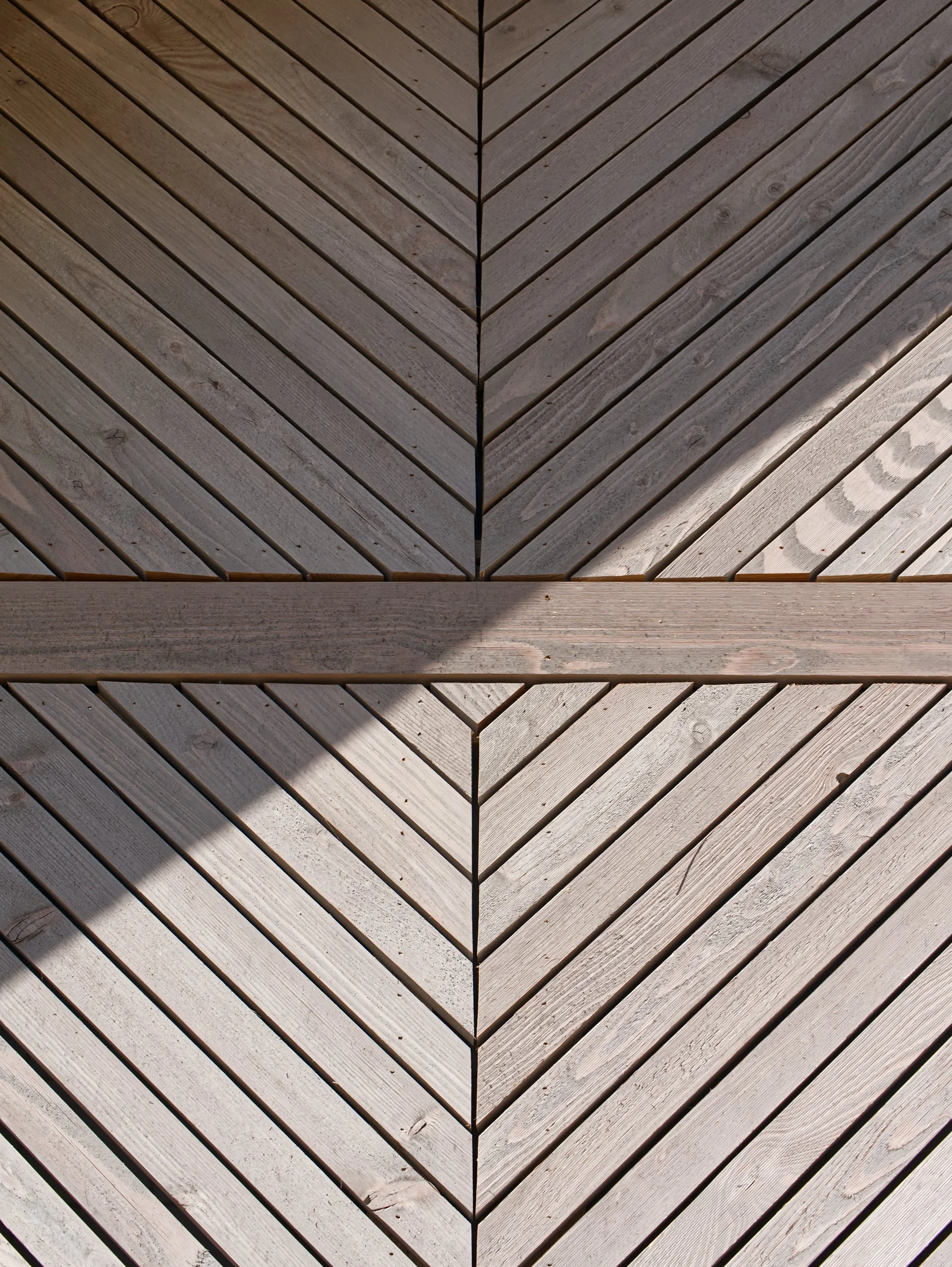 Close up detail of grey chevron timber cladding