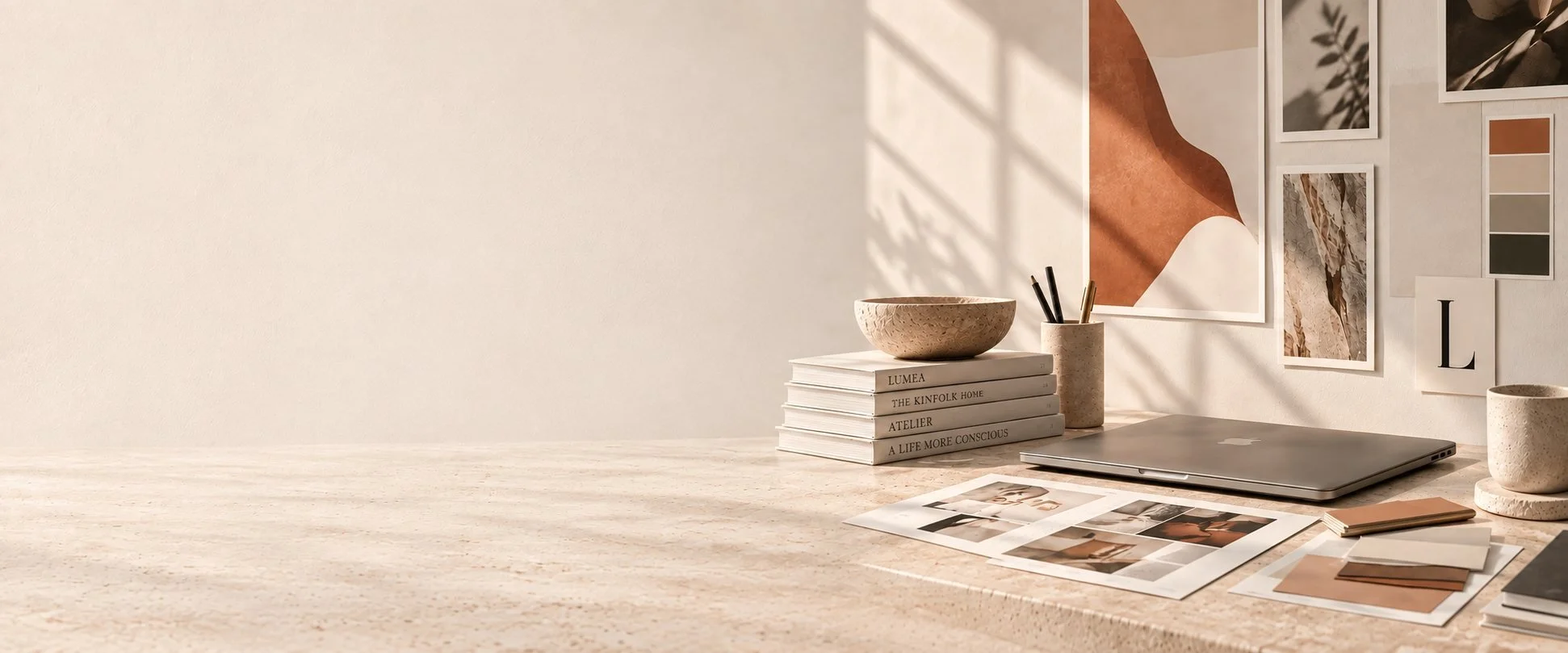 LUMEA studio desk with brand materials, notebooks and color swatches
