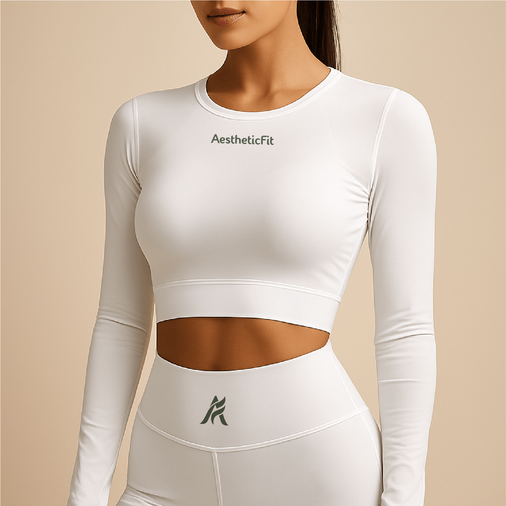 A woman wearing a white crop top and high-waisted leggings with the words 'AestheticFit' on the top and a stylized logo on the leggings.
