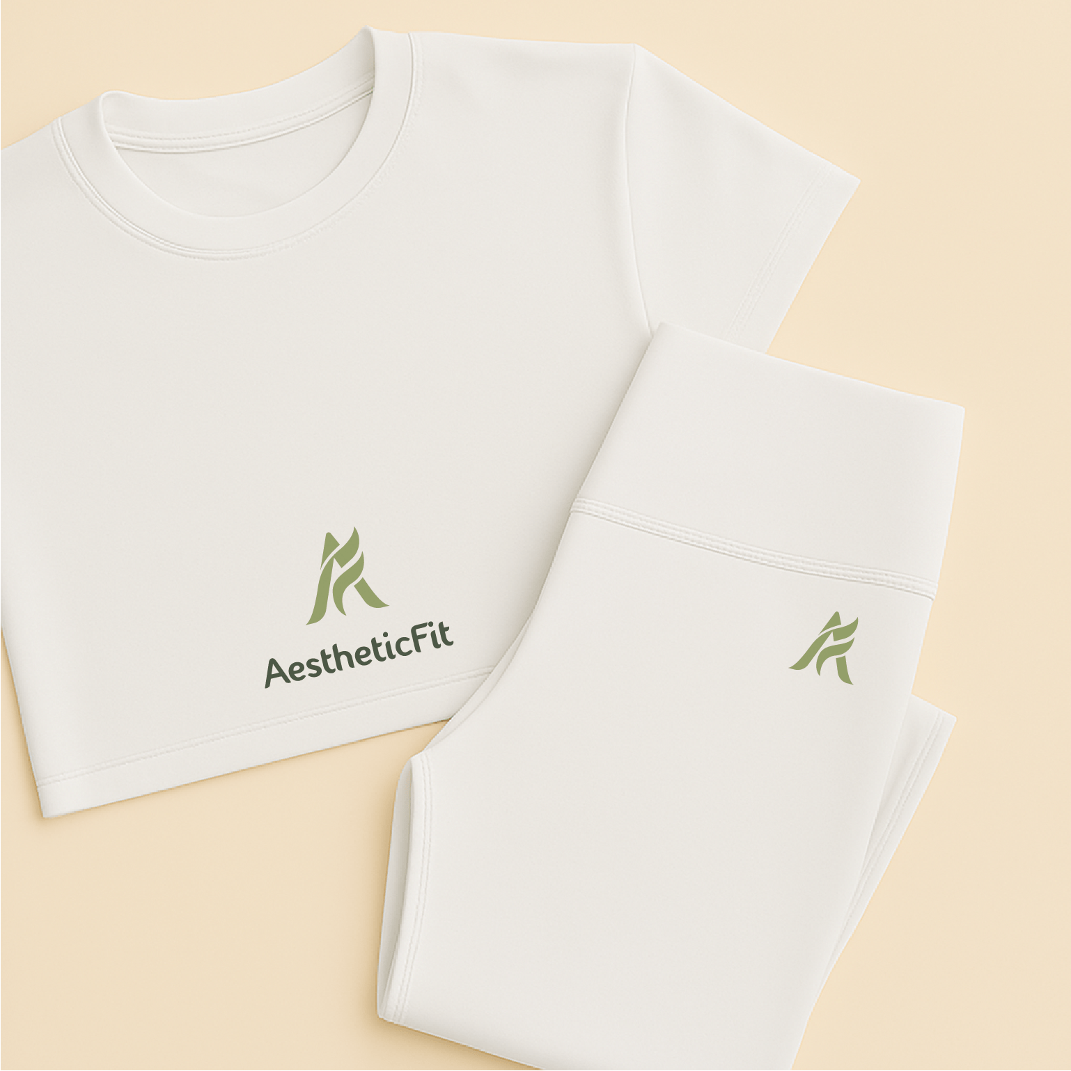 A white T-shirt and white pants, both with the AestheticFit logo in green.