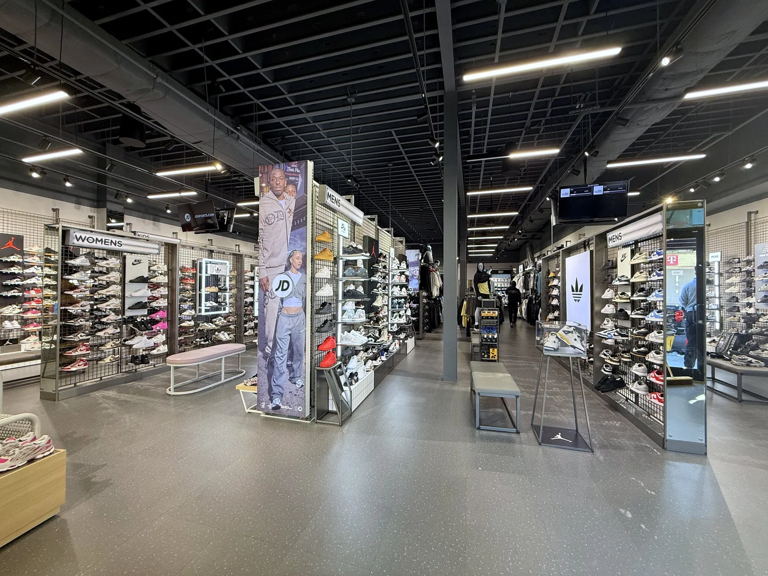 JD Sports sales floor with footwear walls