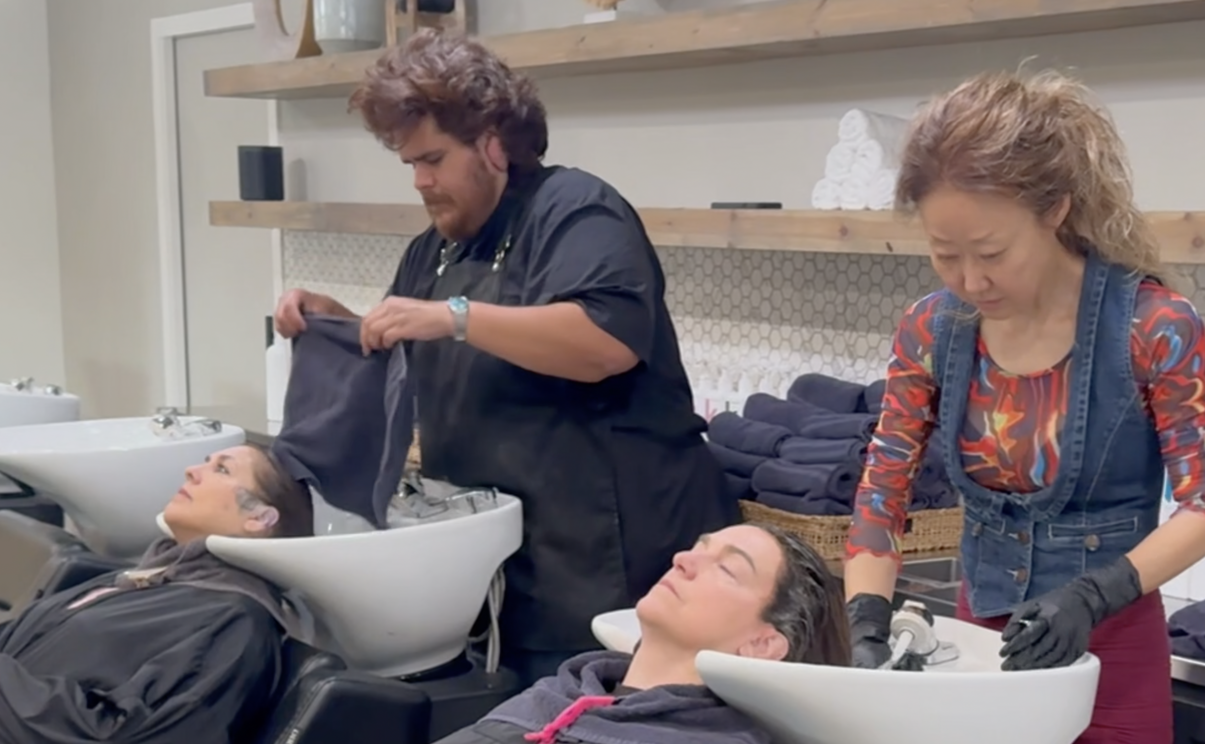 hair stylists at Pure Beauty Bliss in San Antonio, TX washing their clients