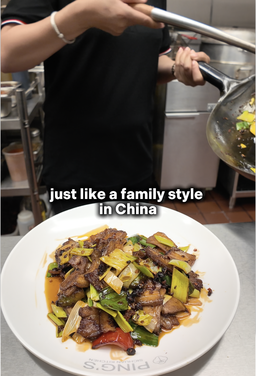 Ping Xia owner of Ping's Sichuan Kitchen cooking one of her iconic dishes, Hui Guo Rou