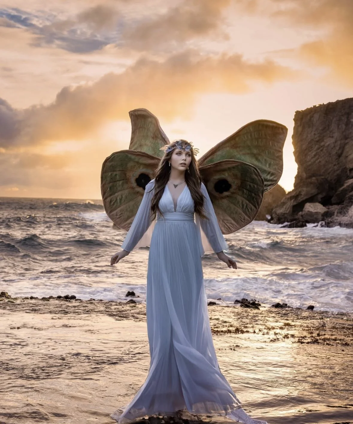 Artistic fairy photoshoot with model in wings by Cozumel shoreline