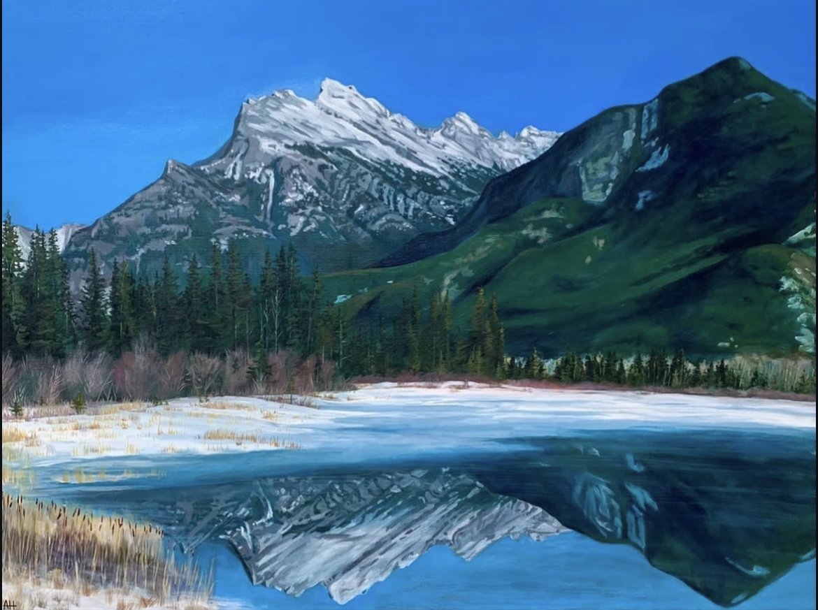 Painting of a snow-capped mountain with a green forest and a reflective lake.
