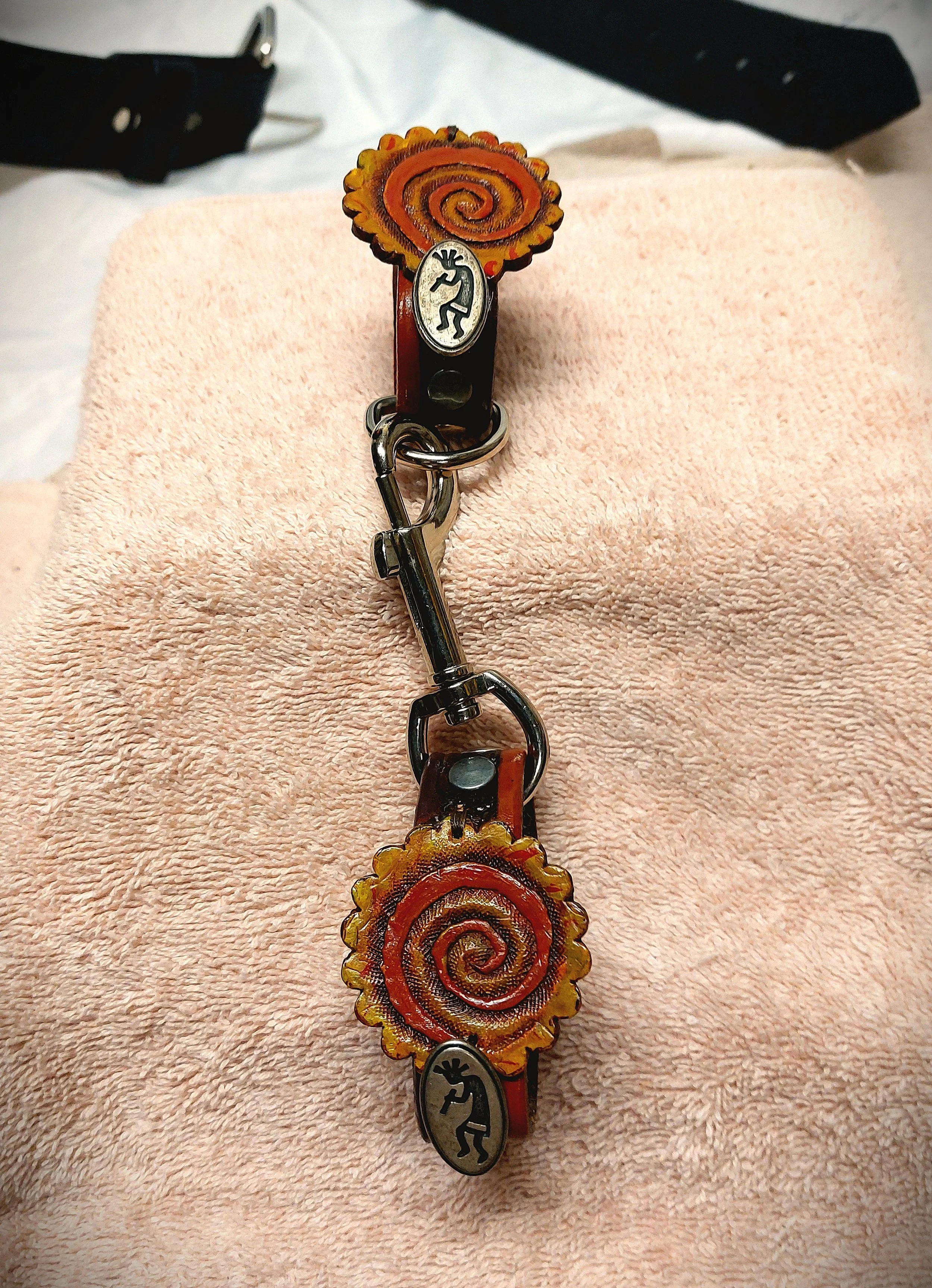 Flame Swirl Tooled Concho with Kokopelli Belt Hangers --Leather Loop Handcuff Style