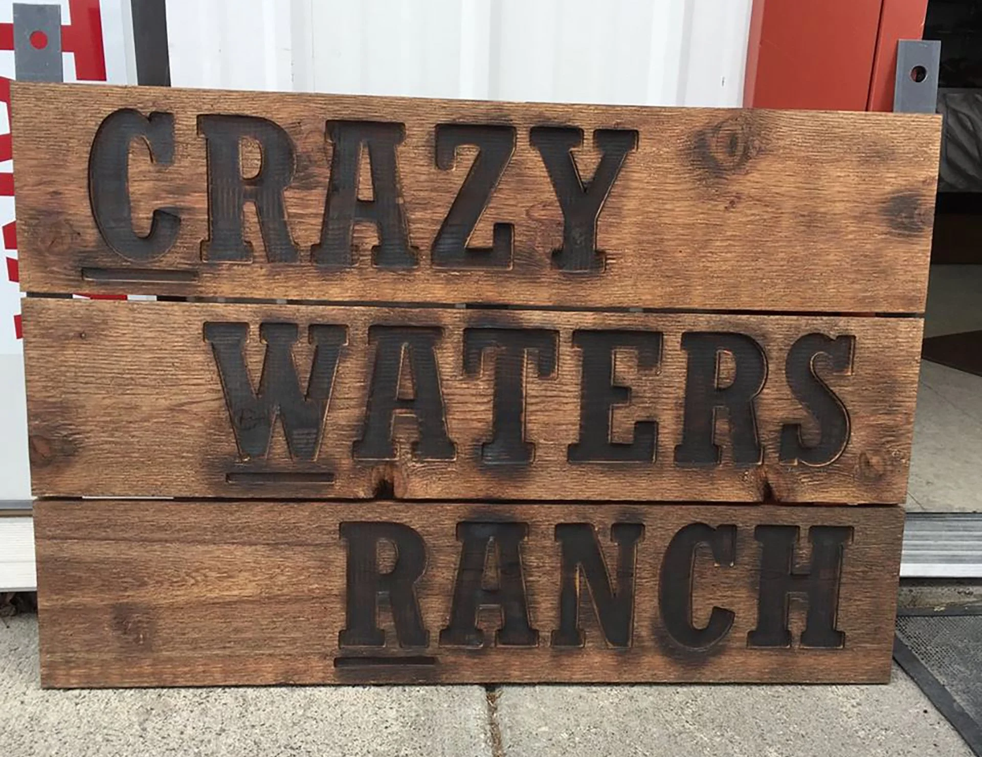crazywatersranchwoodsign.jpg
