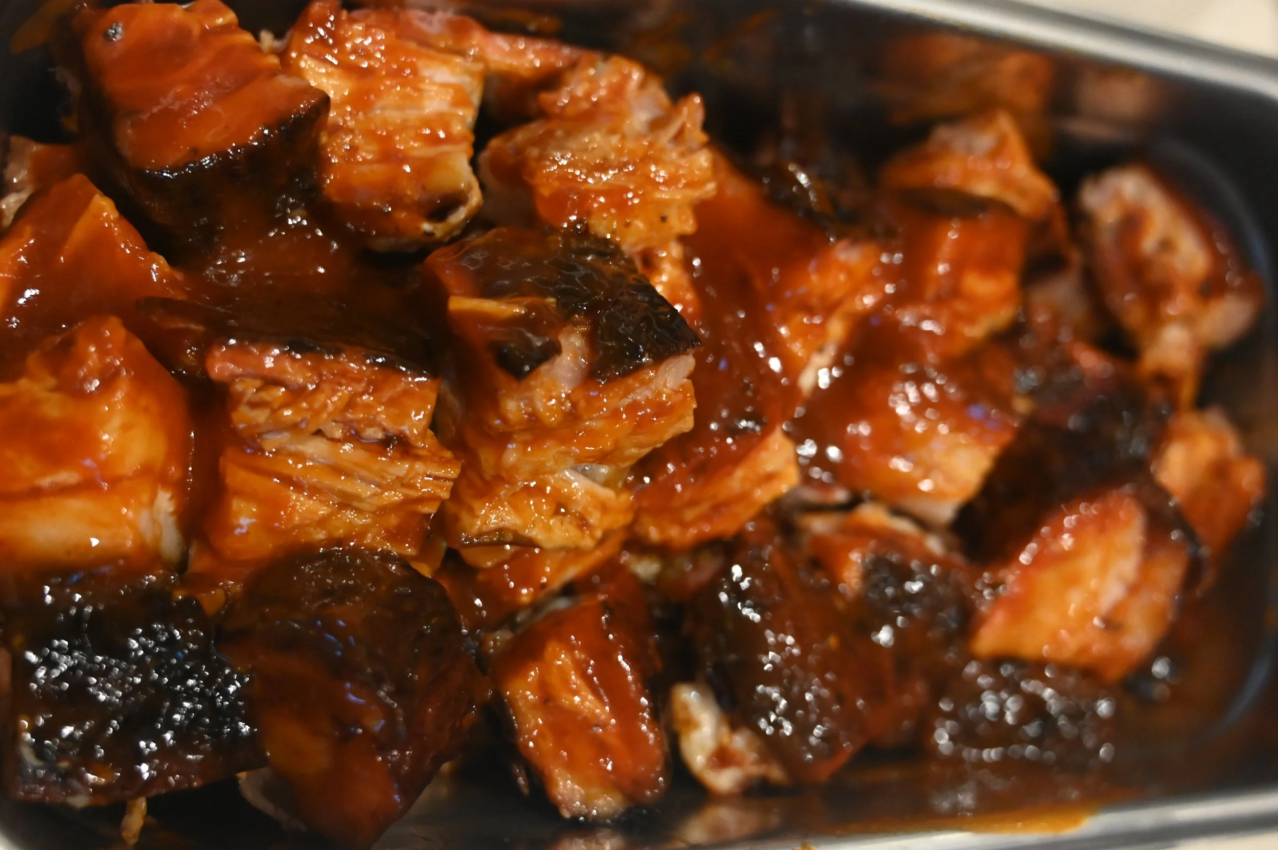 Pork Belly Burnt ends! always a crowd favourite! seasoned with our honey bbq rub and tossed in our maple heat glaze!  