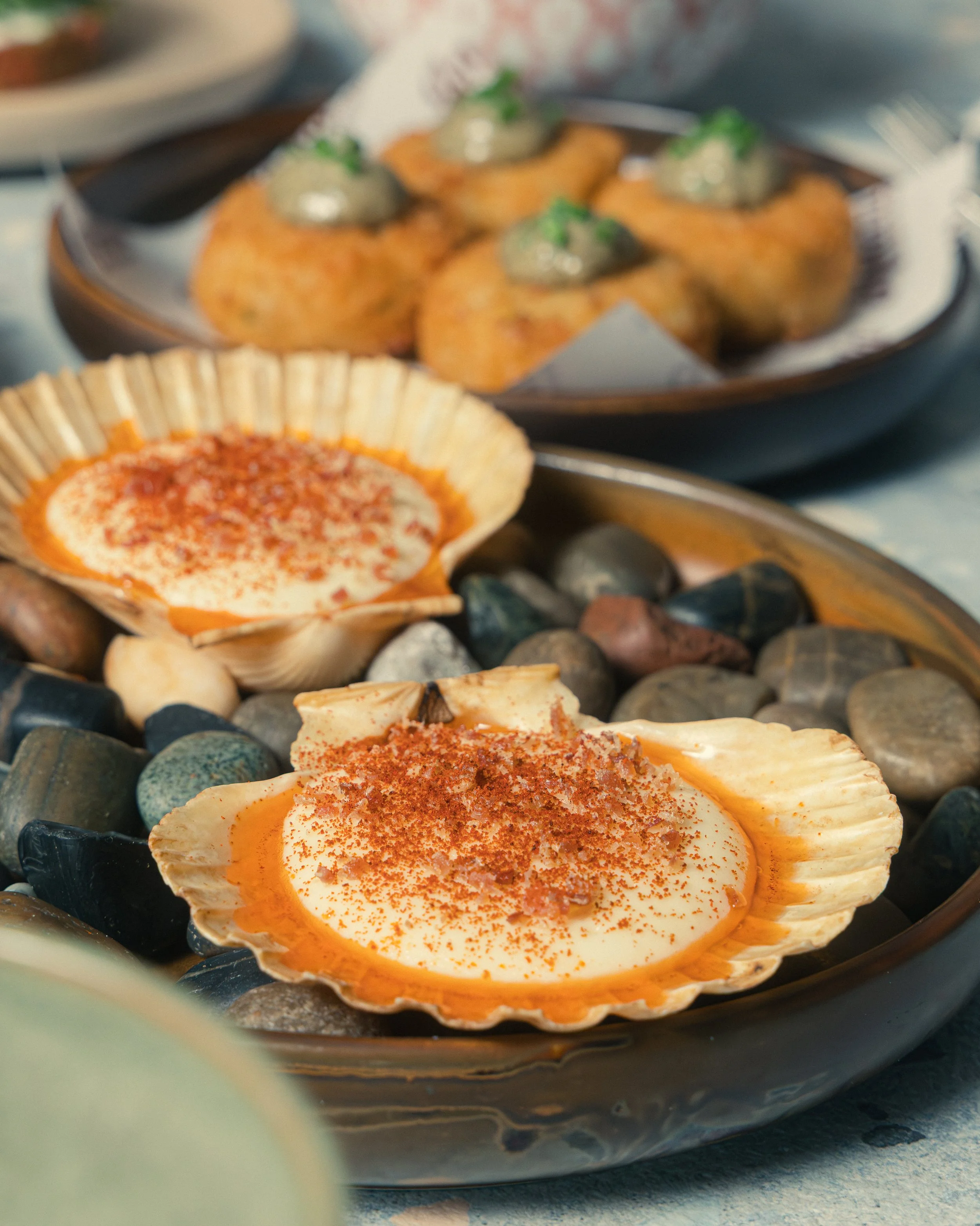 Spanish tapas dish "Viera" roasted scallops served from Tapas share plates menu at Amarilla