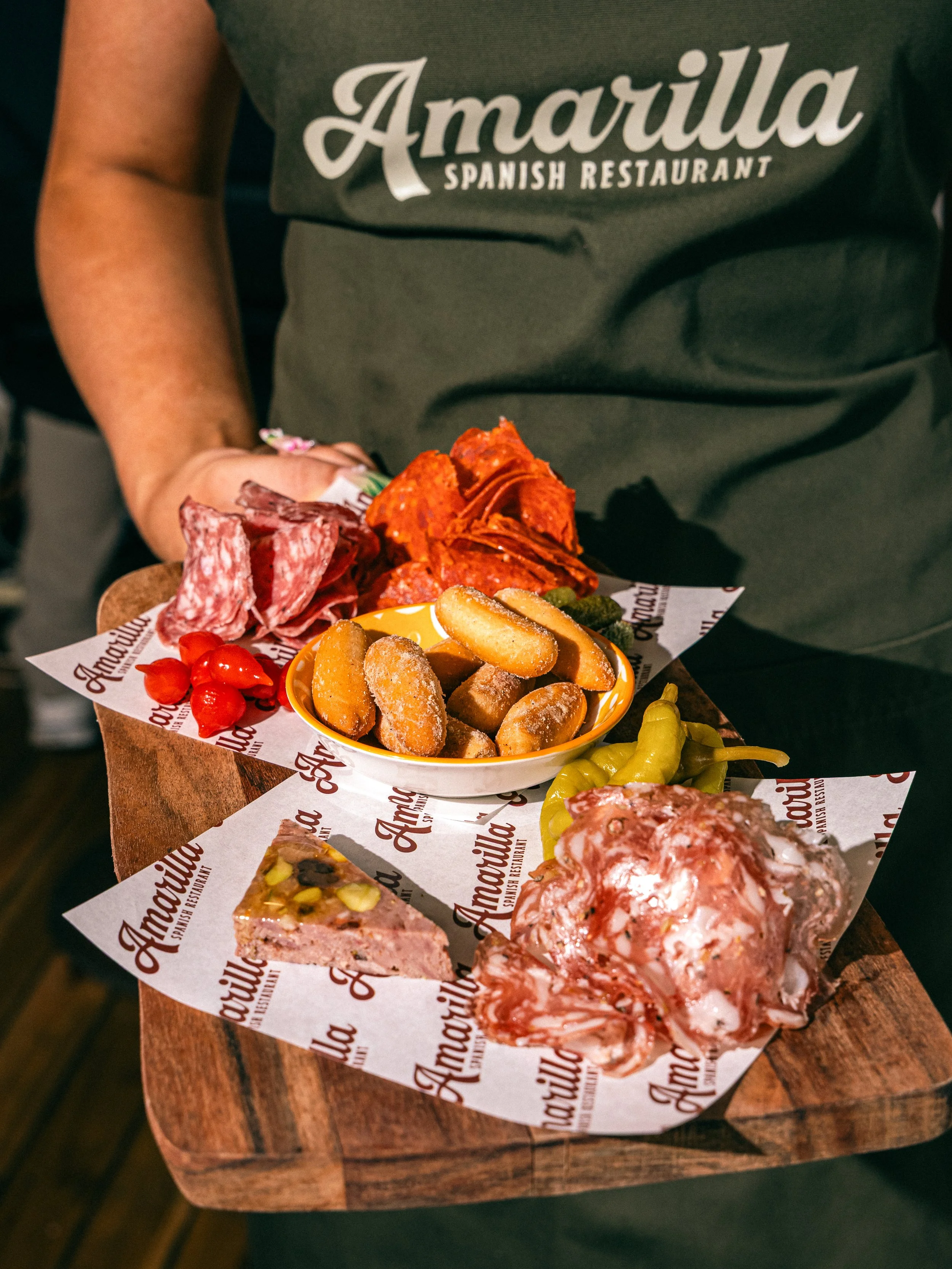 Spanish cold cuts, pickles and bread platter