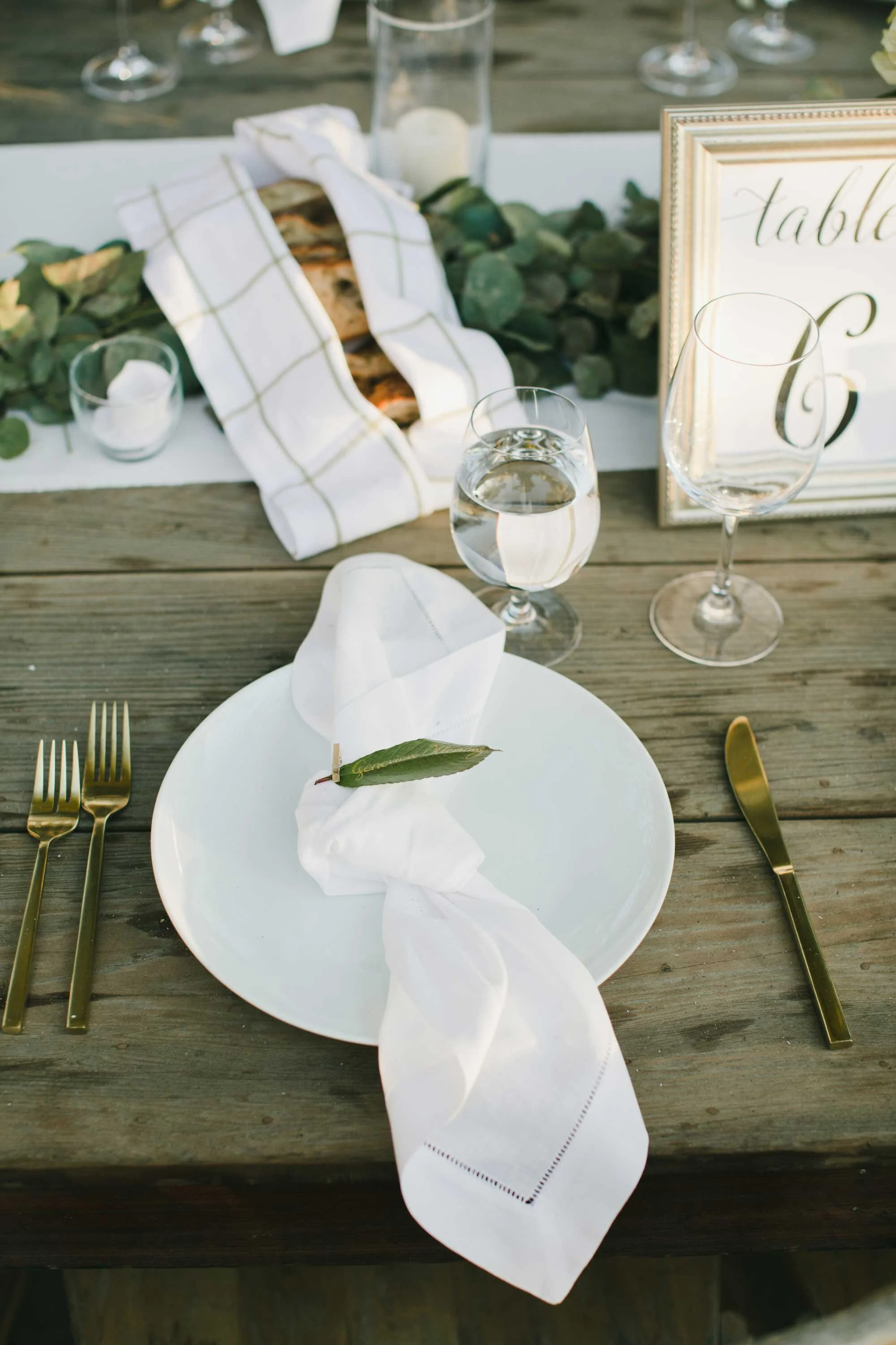 a couple on the porch of the Victorian Farmhouse at Triple S Ranch wedding destination