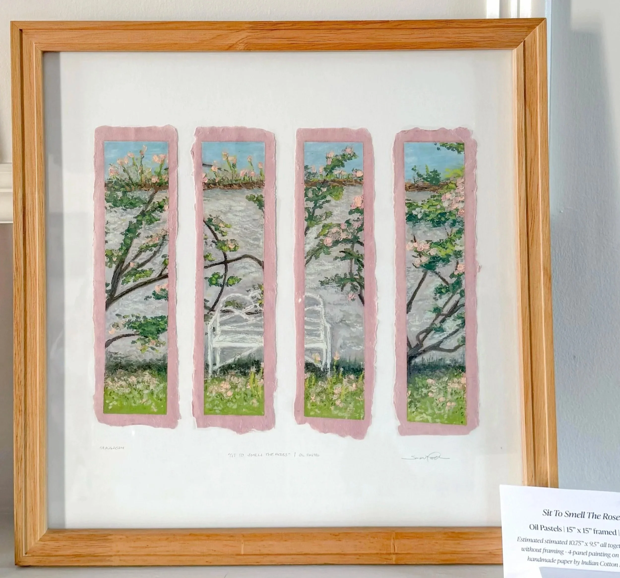 Painting titled 'Sit To Smell The Roses' showing a garden scene with cherry blossom trees and a white bench, divided into four vertical sections with pink borders.