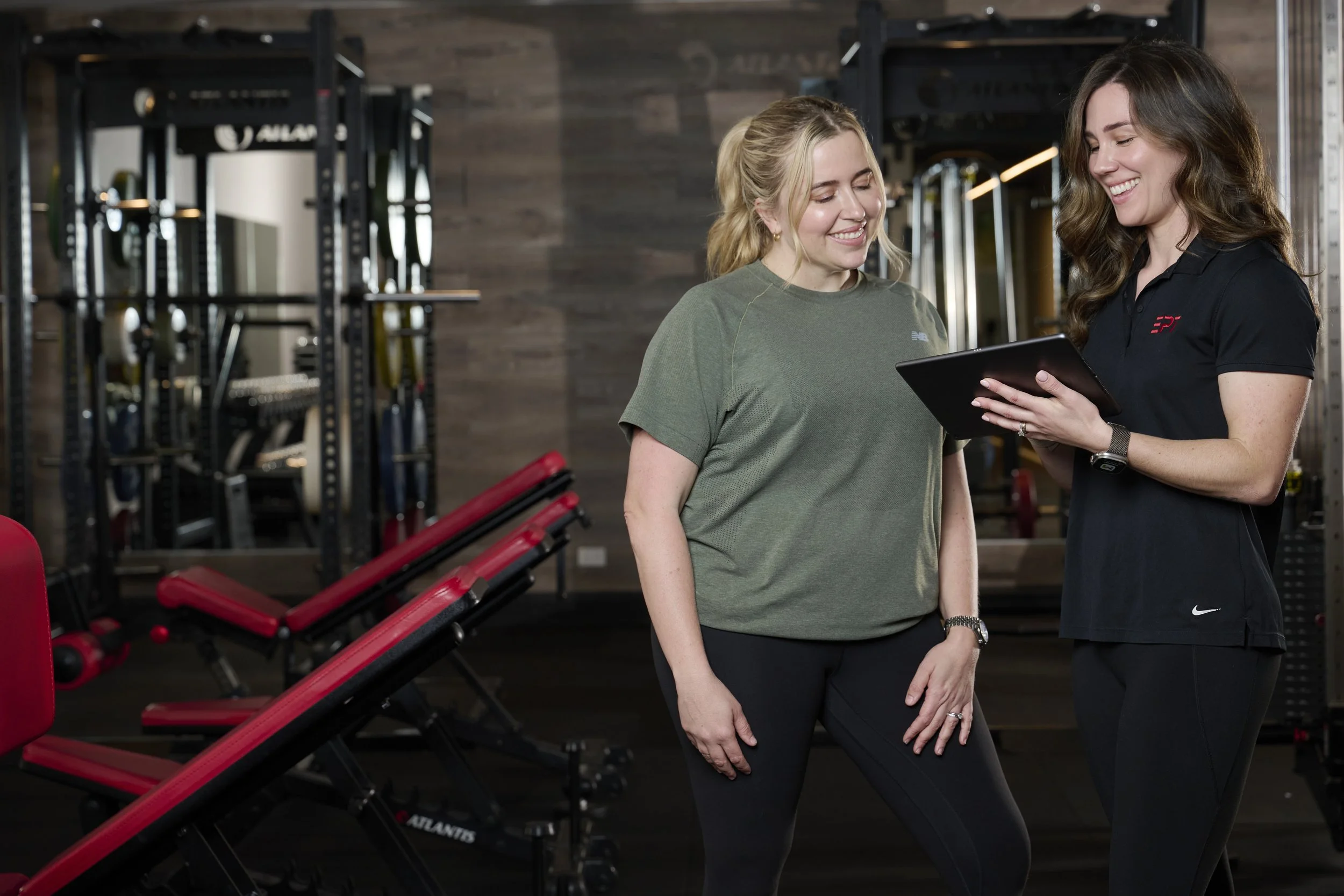 Personal Trainer at EPT Subiaco showing EPT client crystal the plan for her strength block