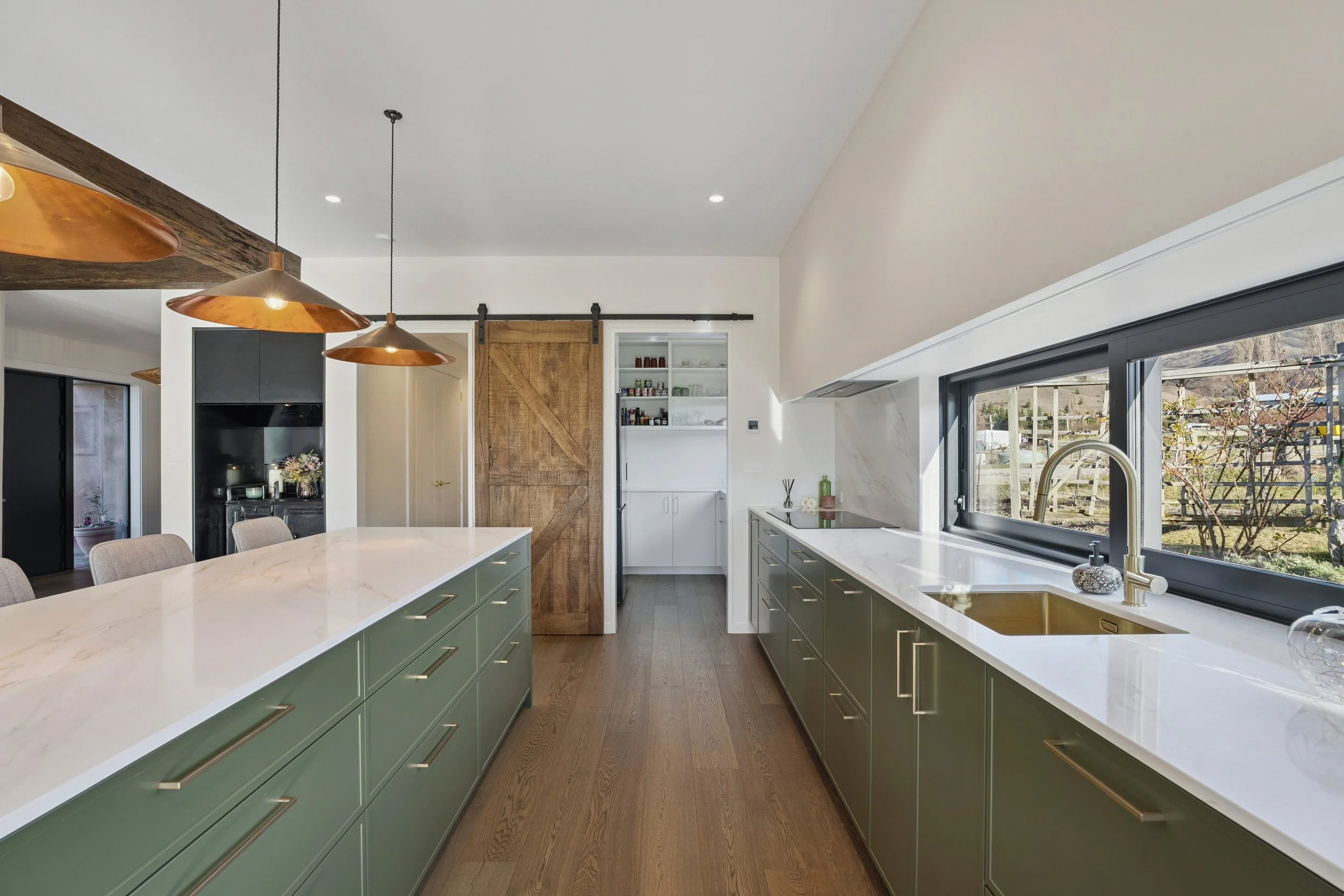 Moscato Oak in kitchen with green and brass cabinetry