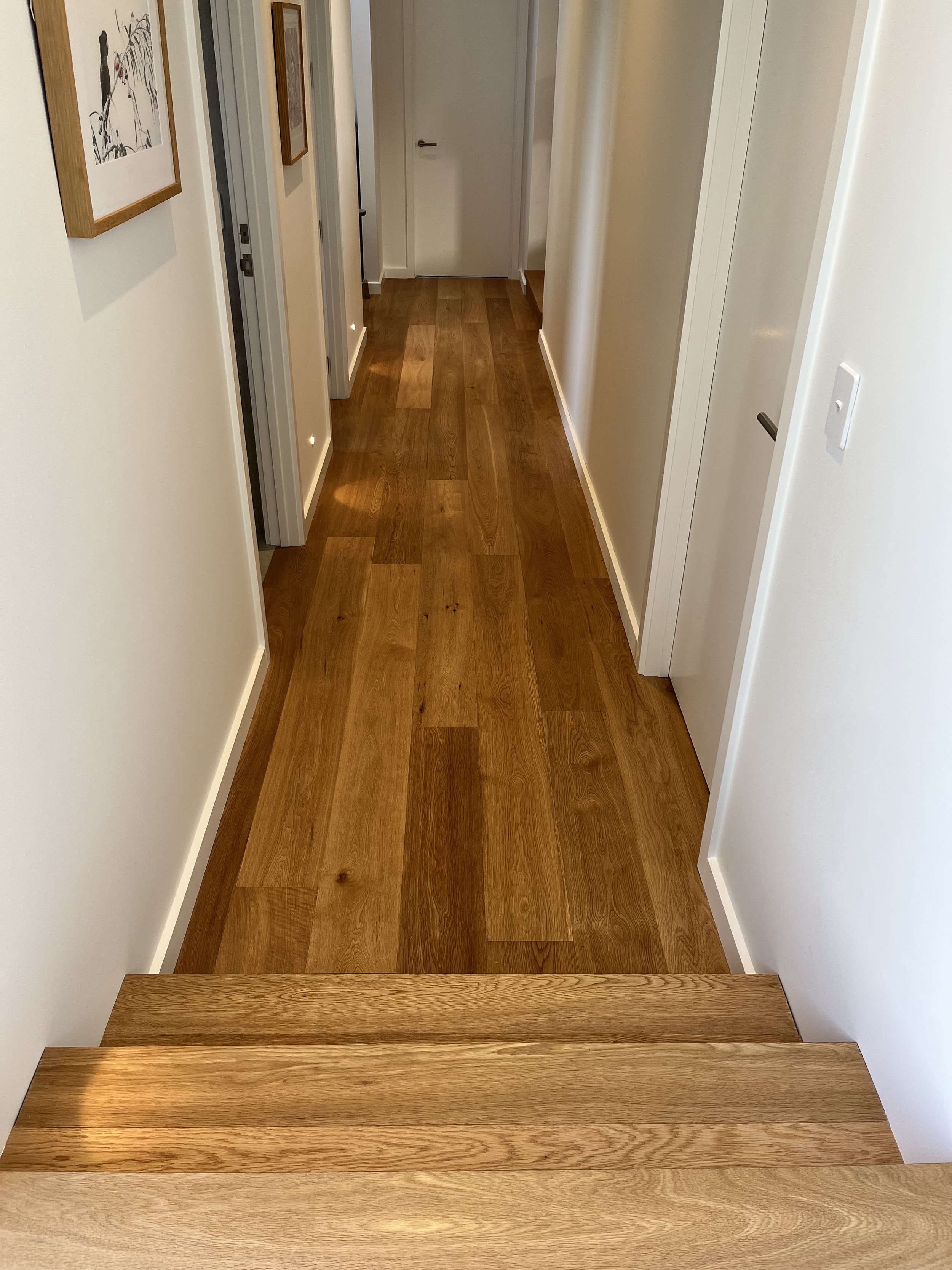 Natural finish stairs and hallway