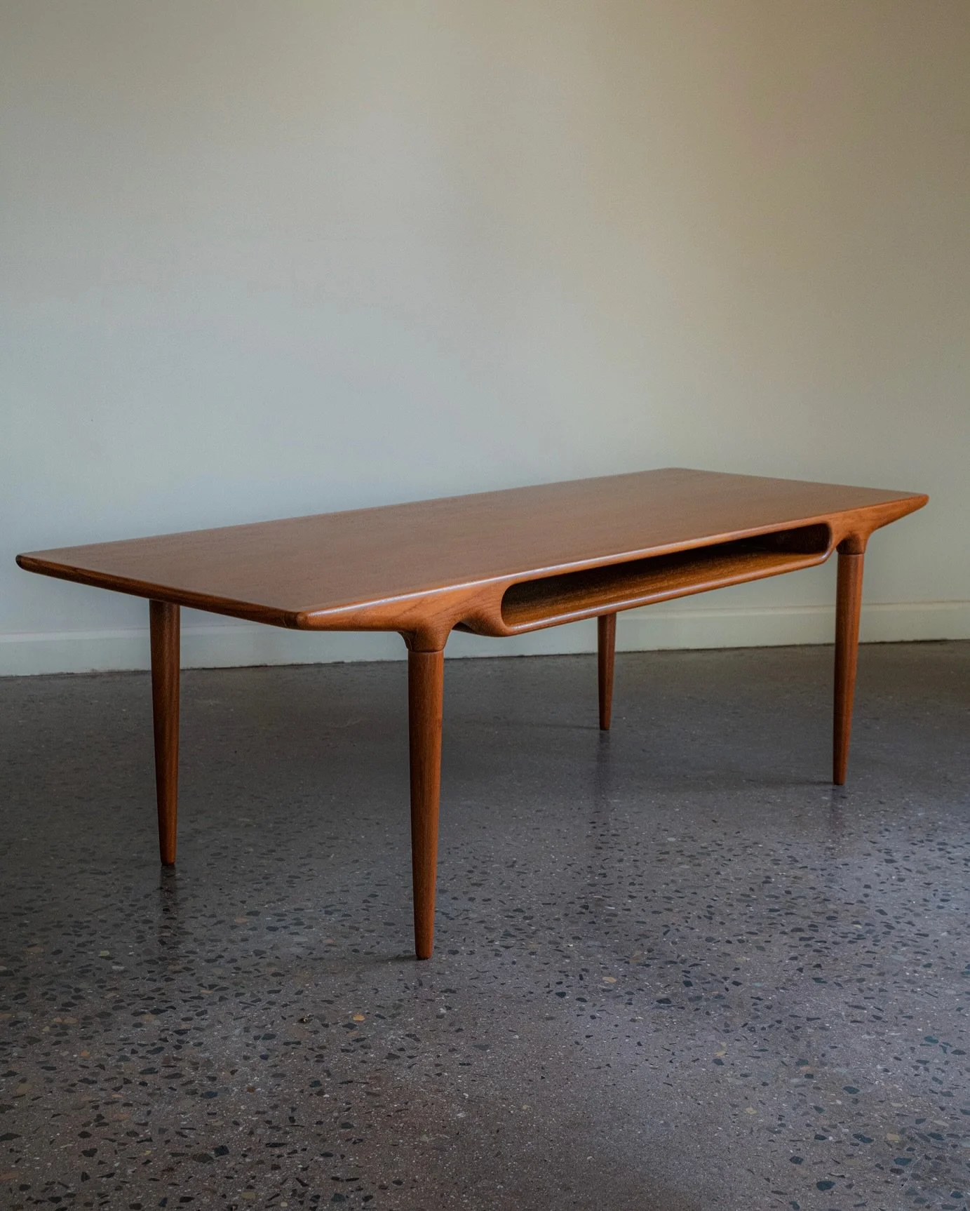 Freshly restored and ready for its next home: the coveted Johannes Andersen &lsquo;Model 240&rsquo; Coffee Table in Teak.

We are incredibly fortunate to have imported this very rare and jaw-droppingly stunning Danish design collectable.

Designed by