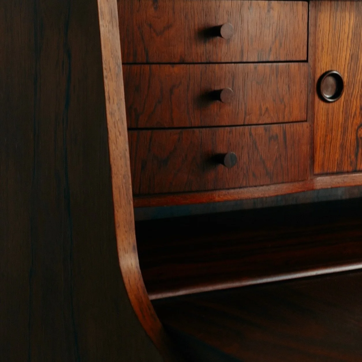 New in Store: Stunning Danish Bureau in Rosewood, with expressive grain, turned legs, and internal drawers hidden behind a foldable desk-top. 

Origin: Denmark, c.1960s.

Dimensions: W92 x D41 x H108 cm 

Condition: Excellent mid century condition wi