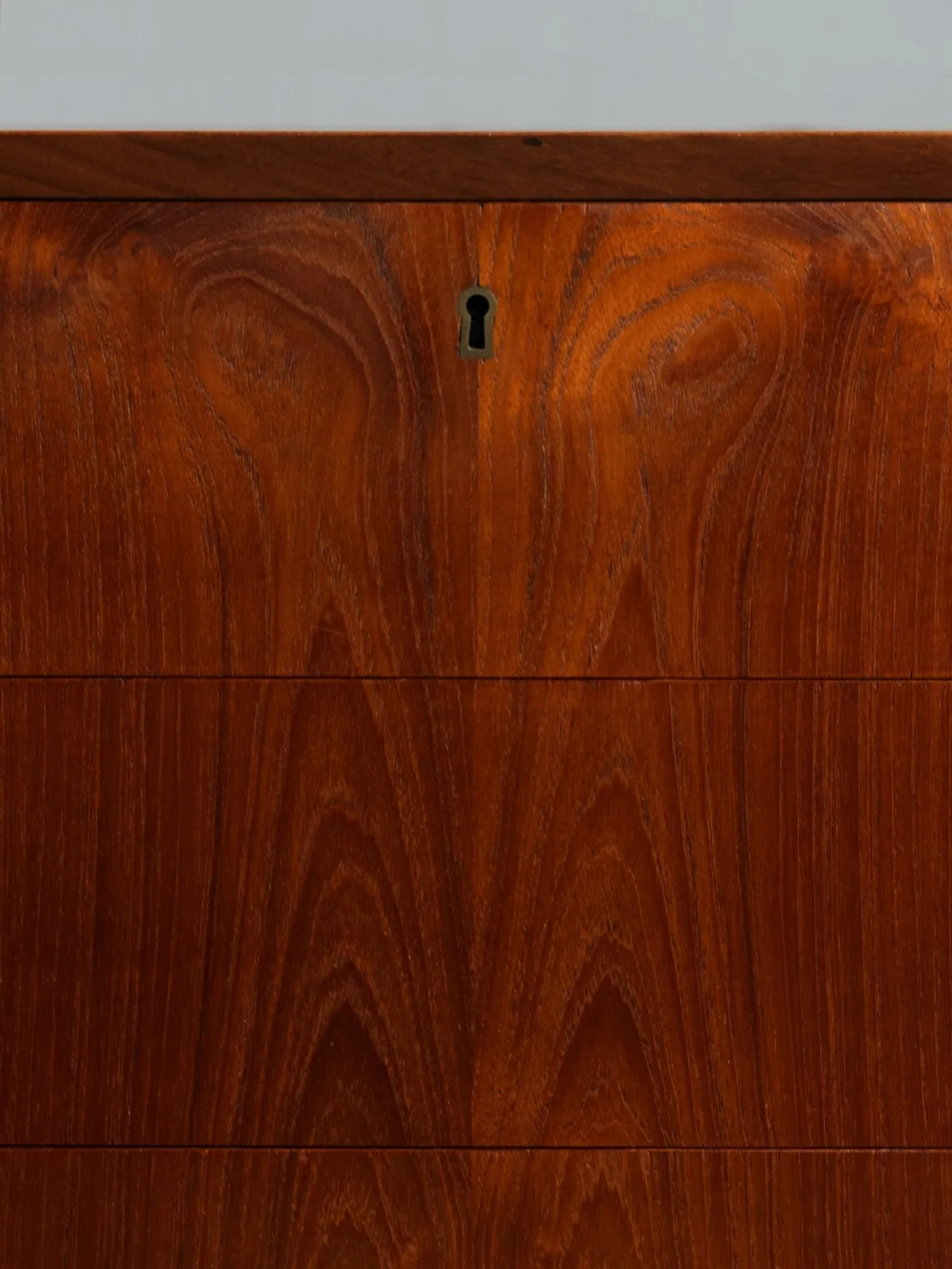 Feast your eyes on this shimmering goodness &mdash; a sleek as heck teak chest of drawers circa 1960s Denmark.

Featuring seven drawers and a classically refined Scandinavian design, this taller than usual chest is a bedroom staple, with ample storag