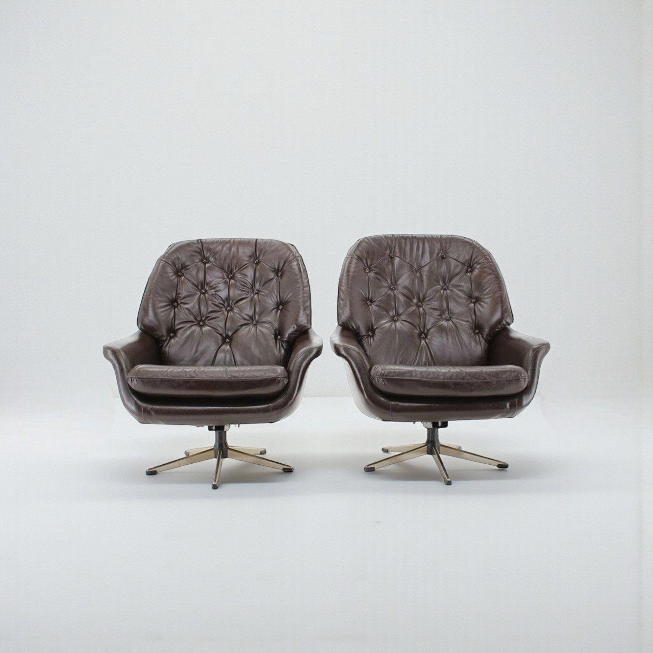 Pair of Leather Swivel Chairs by HW Klein