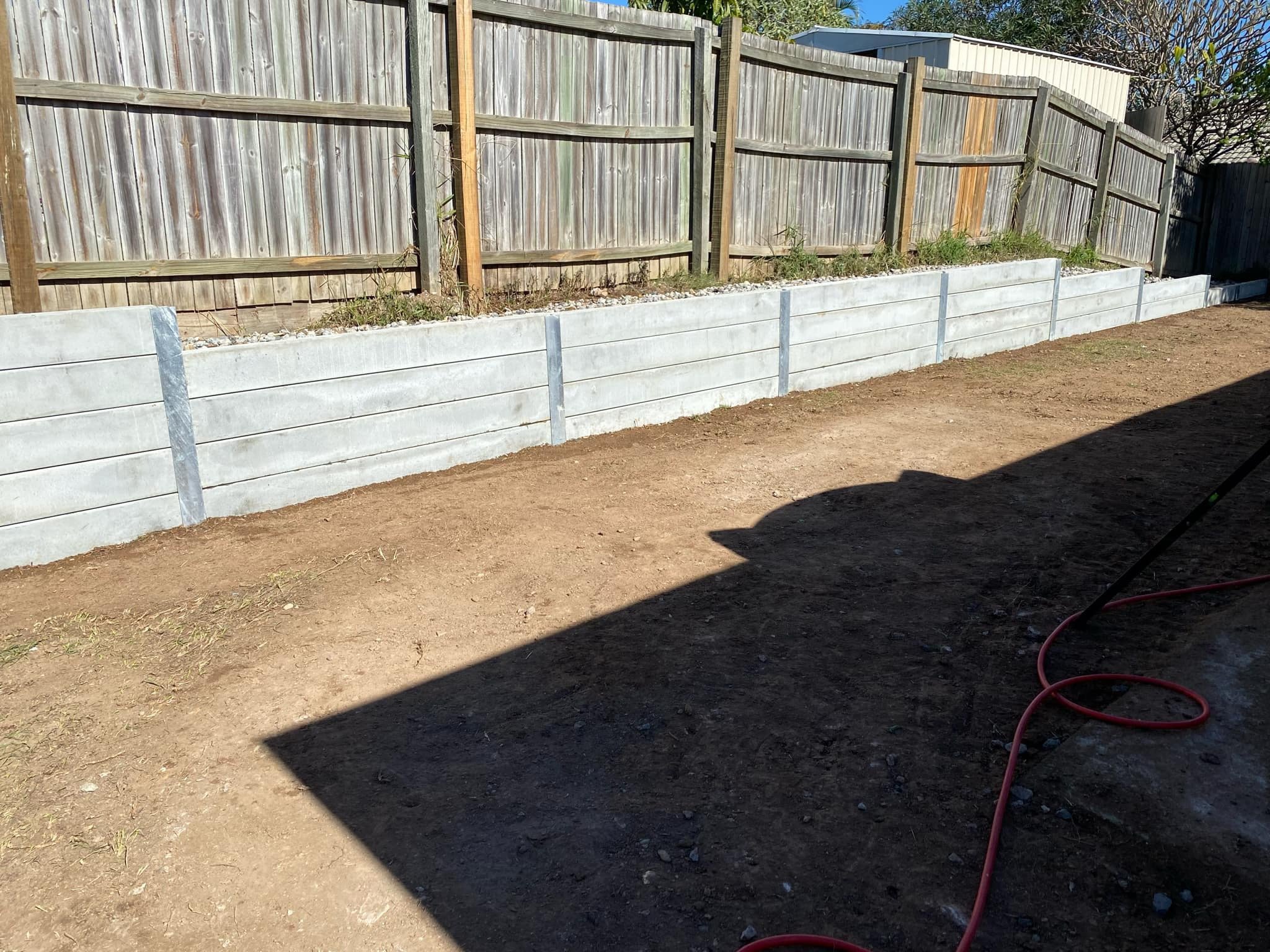 Cement retaining walls are built to last. The client here opted for a timber fence on top to ensure plenty of privacy.