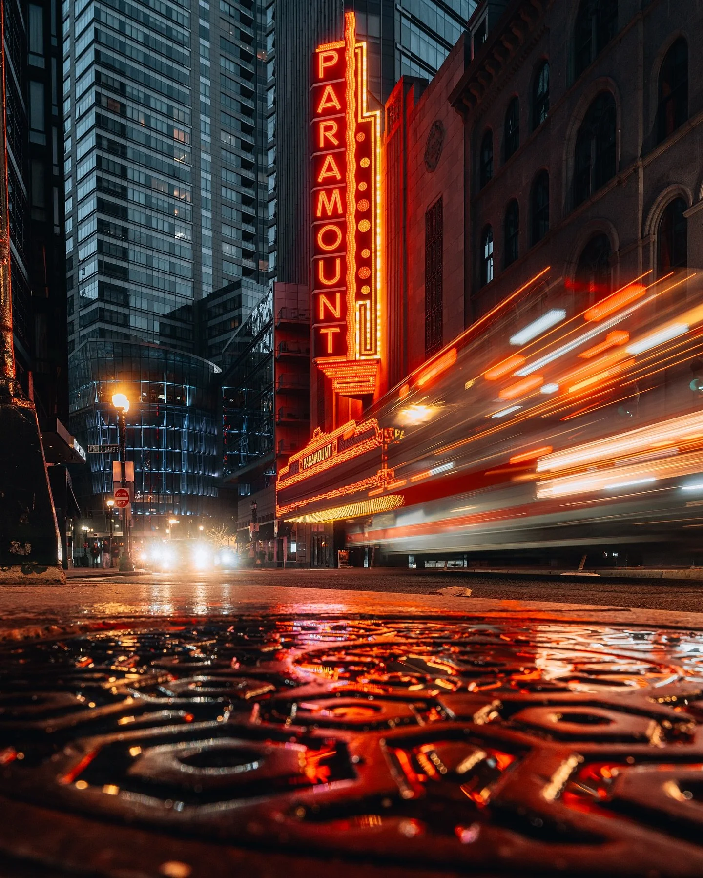 Boston after dark just hits different ✨ 

Neon glowing. Pavement still wet. Traffic rushing past the Paramount like the city forgot to sleep. Nights like this remind me why I keep the camera low and wait. The reflections. The motion. That split secon
