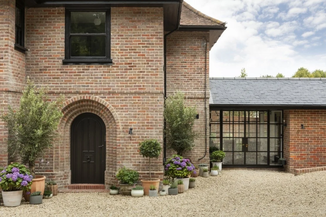 Extension and reconfiguration of 1930s house