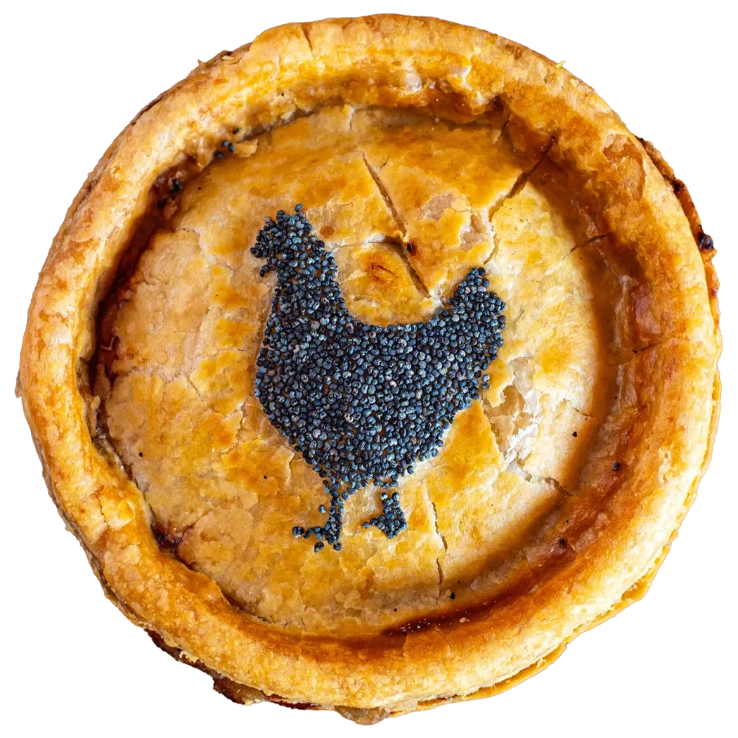 Handmade chicken pie by Bristol Pie Society, decorated with a poppy seed chicken silhouette stencil on the pastry crust.