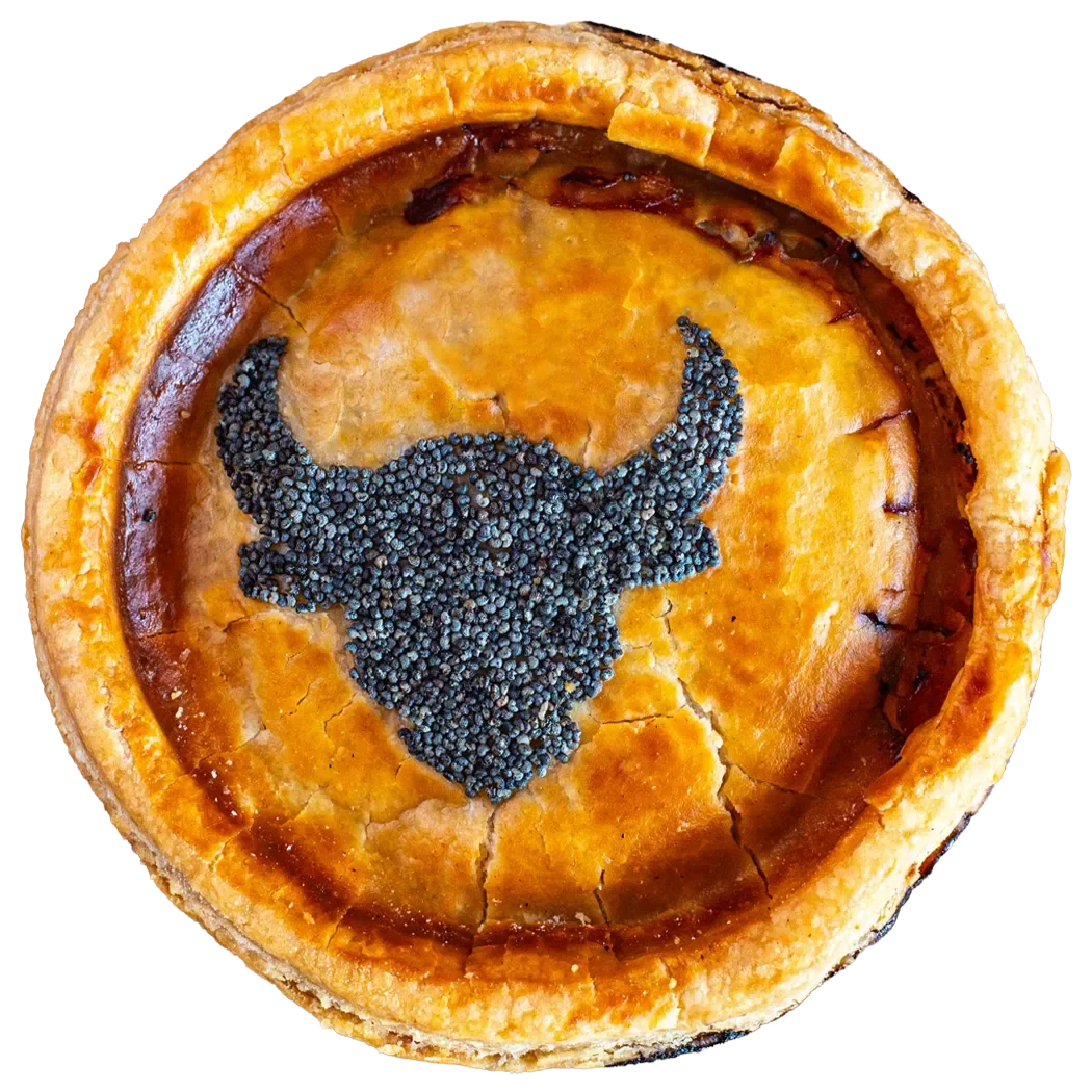 Handmade beef pie from Bristol Pie Society featuring a golden crust and a signature poppy seed bull design.