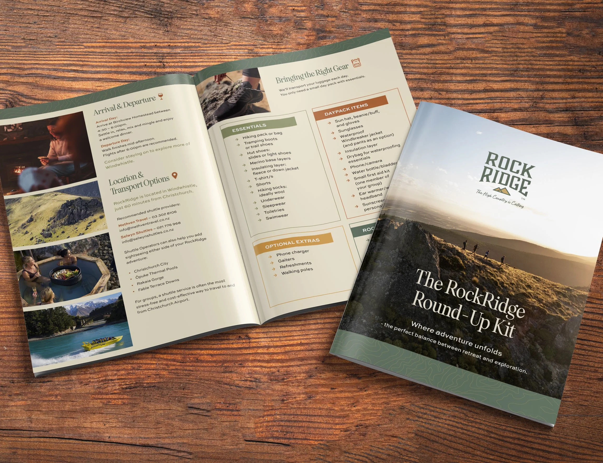 Open RockRidge Round-Up Kit brochure on wooden surface, showing scenic outdoor landscape with hikers, and an open booklet with travel information, essentials, options, and contact details.