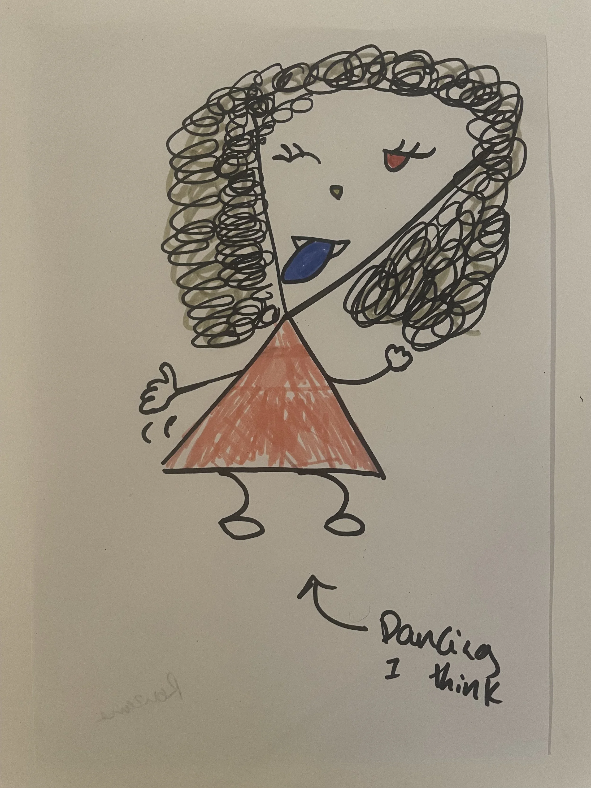 A dancing figure with a stuck out tongue and curled hair. Text reads 'dancing I think'.