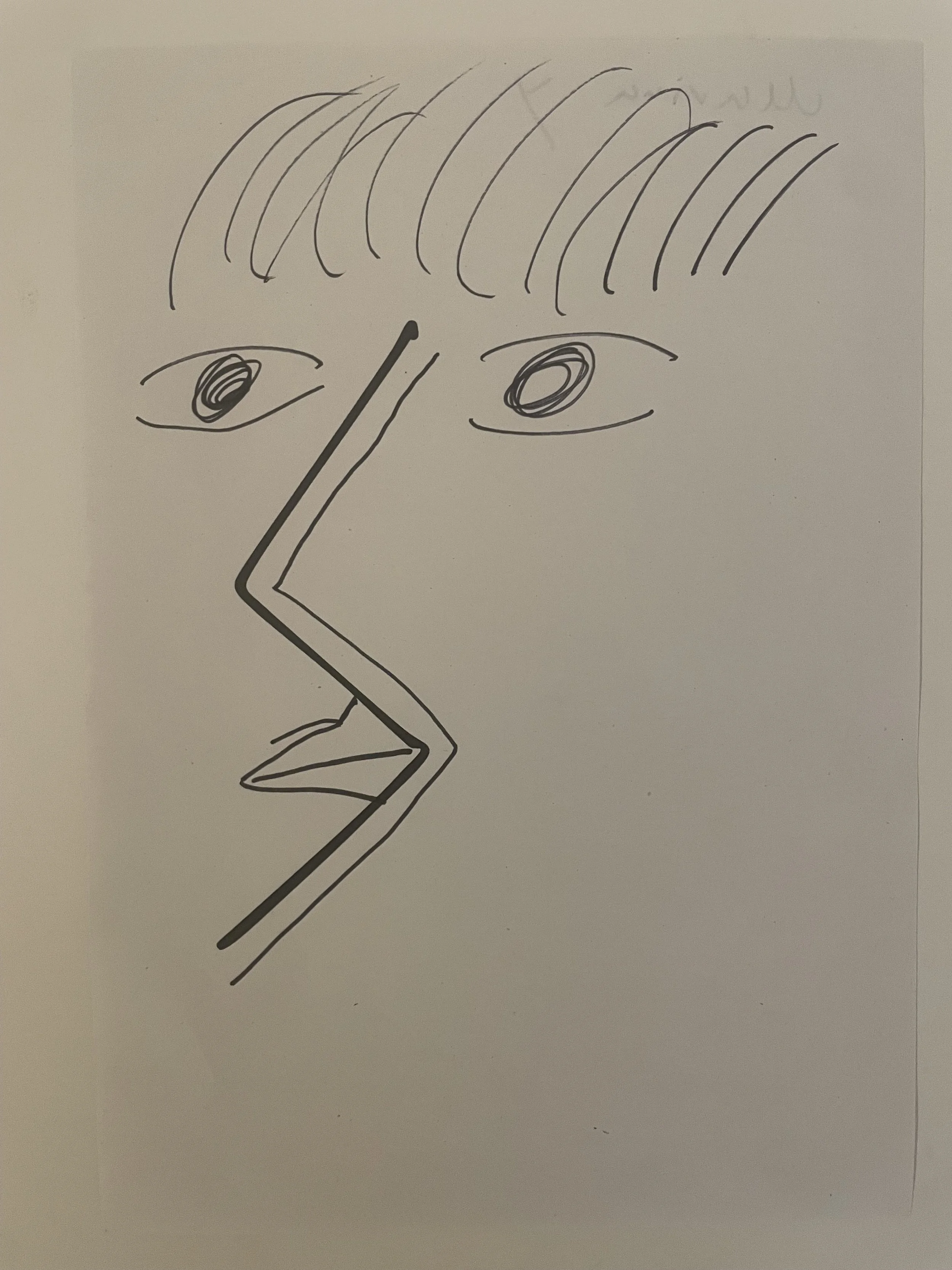 A face with a zig zag at the centre, and half a mouth.