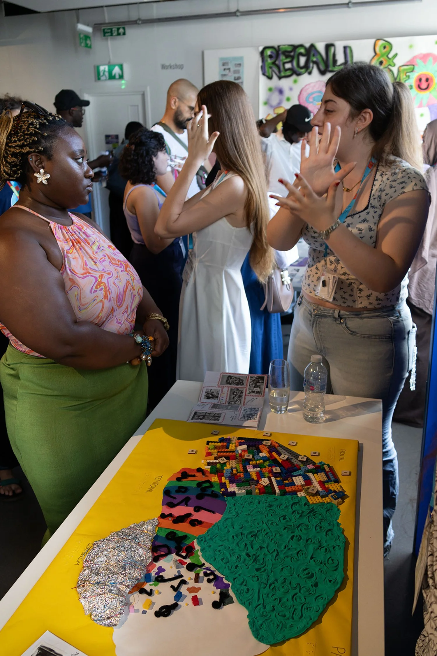 A member of The Brain through Touch group demonstrates the project to an audience member.