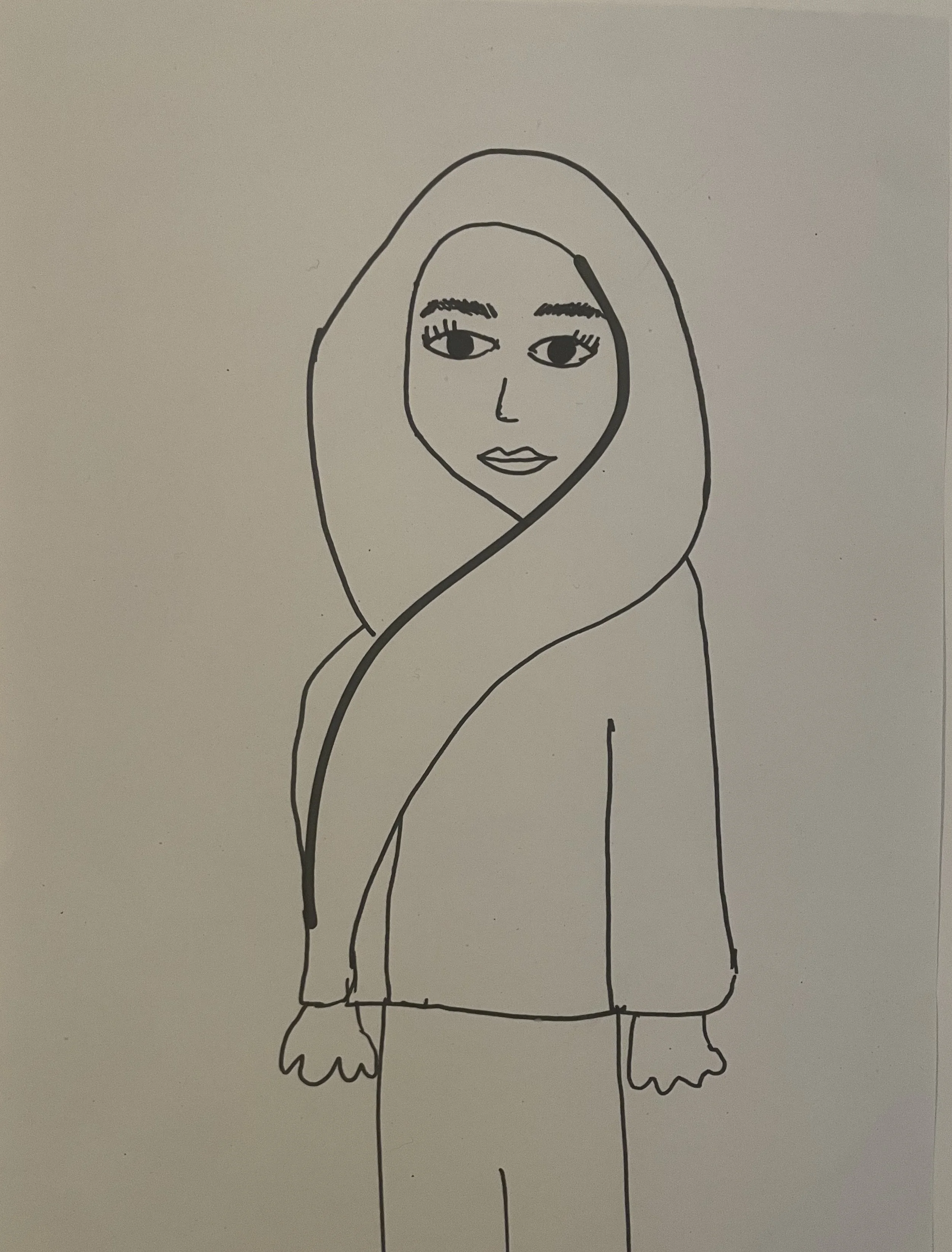 A person stands facing out with a headscarf swirling across the front of their body.