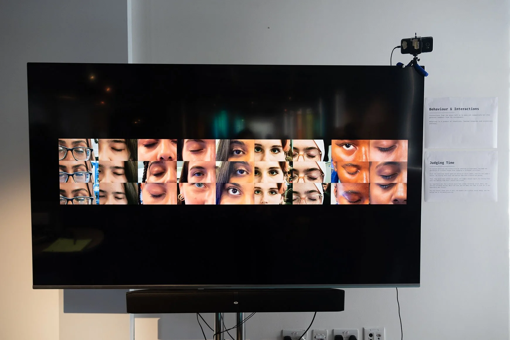 An edited digital image on a screen with a collage of closed and open eyes.