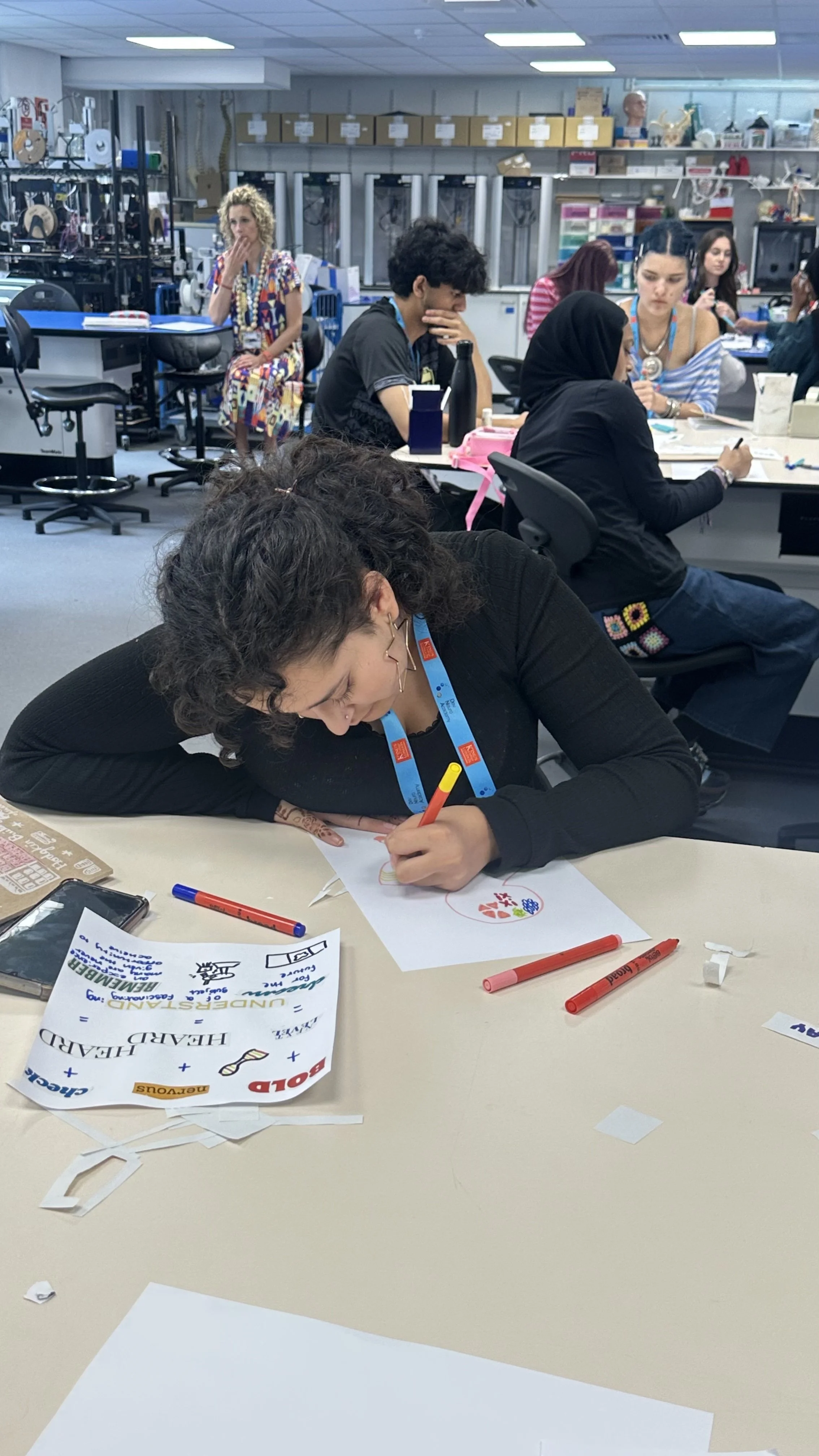 A DNA Participant works on their creative reflection.