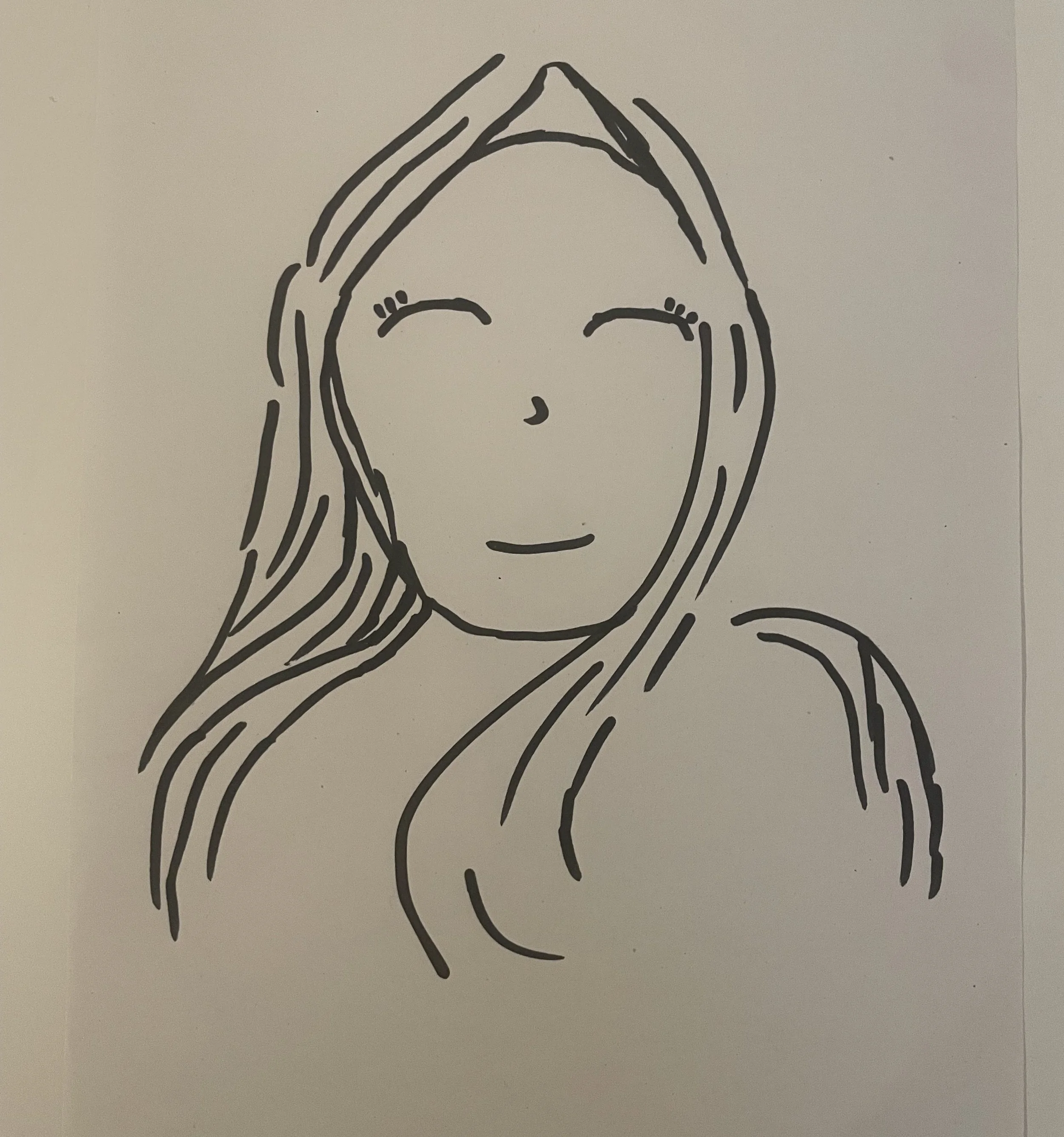 A sketch of a smiling face with swirling fabric around it.