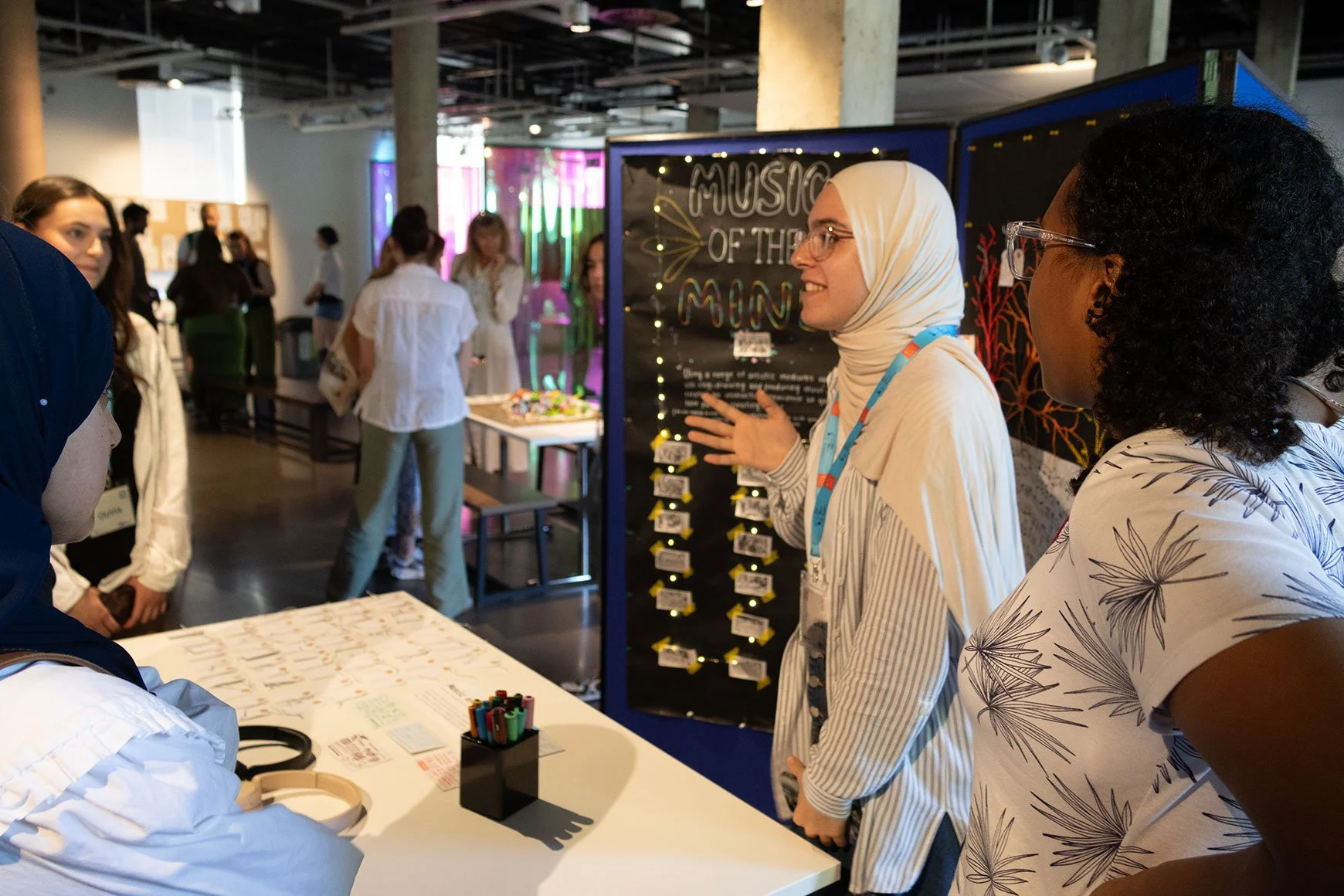 Music of the Mind group members demonstrate their installation to audiences.