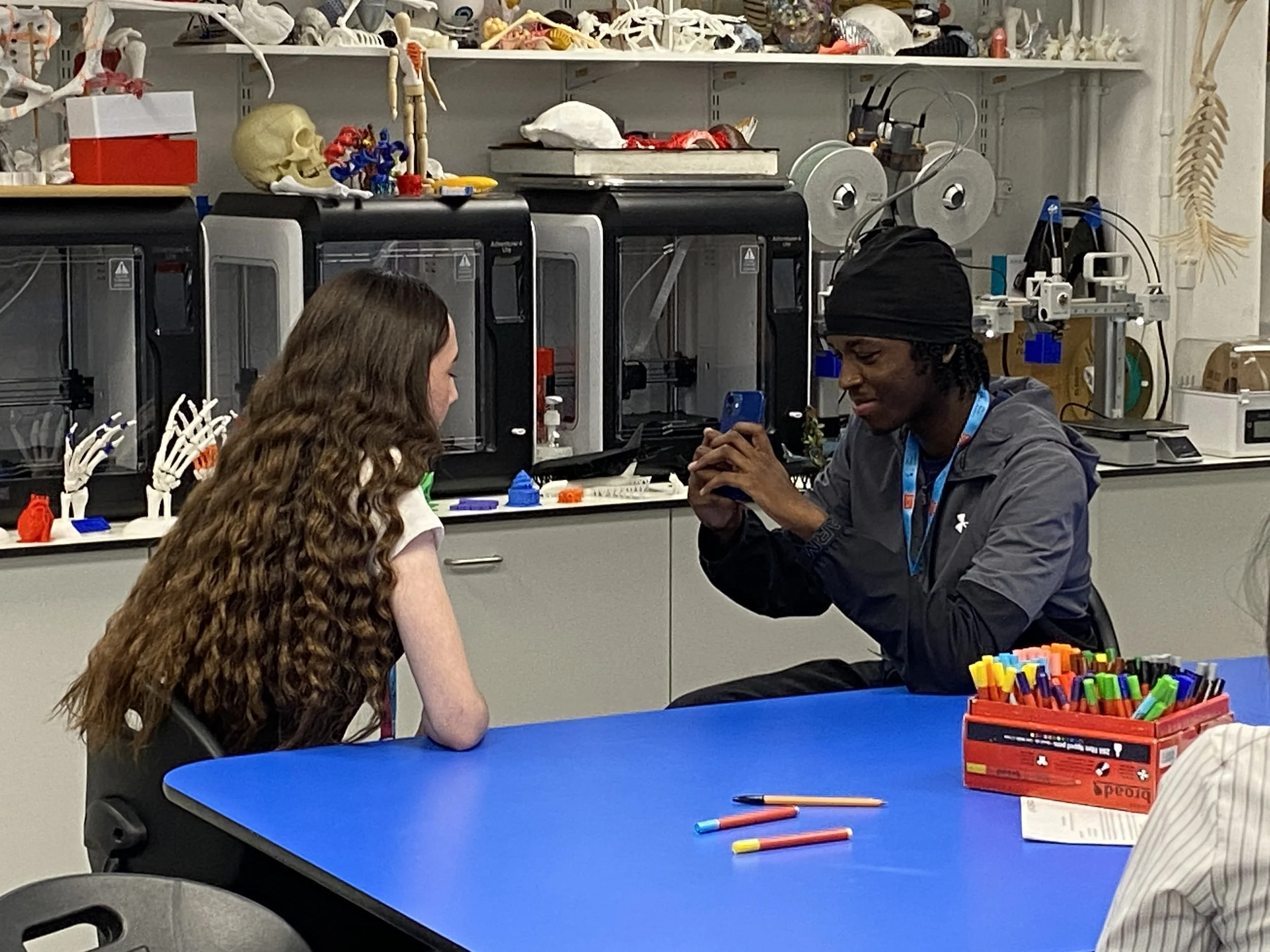 A DNA Champion films a DNA participant films another.