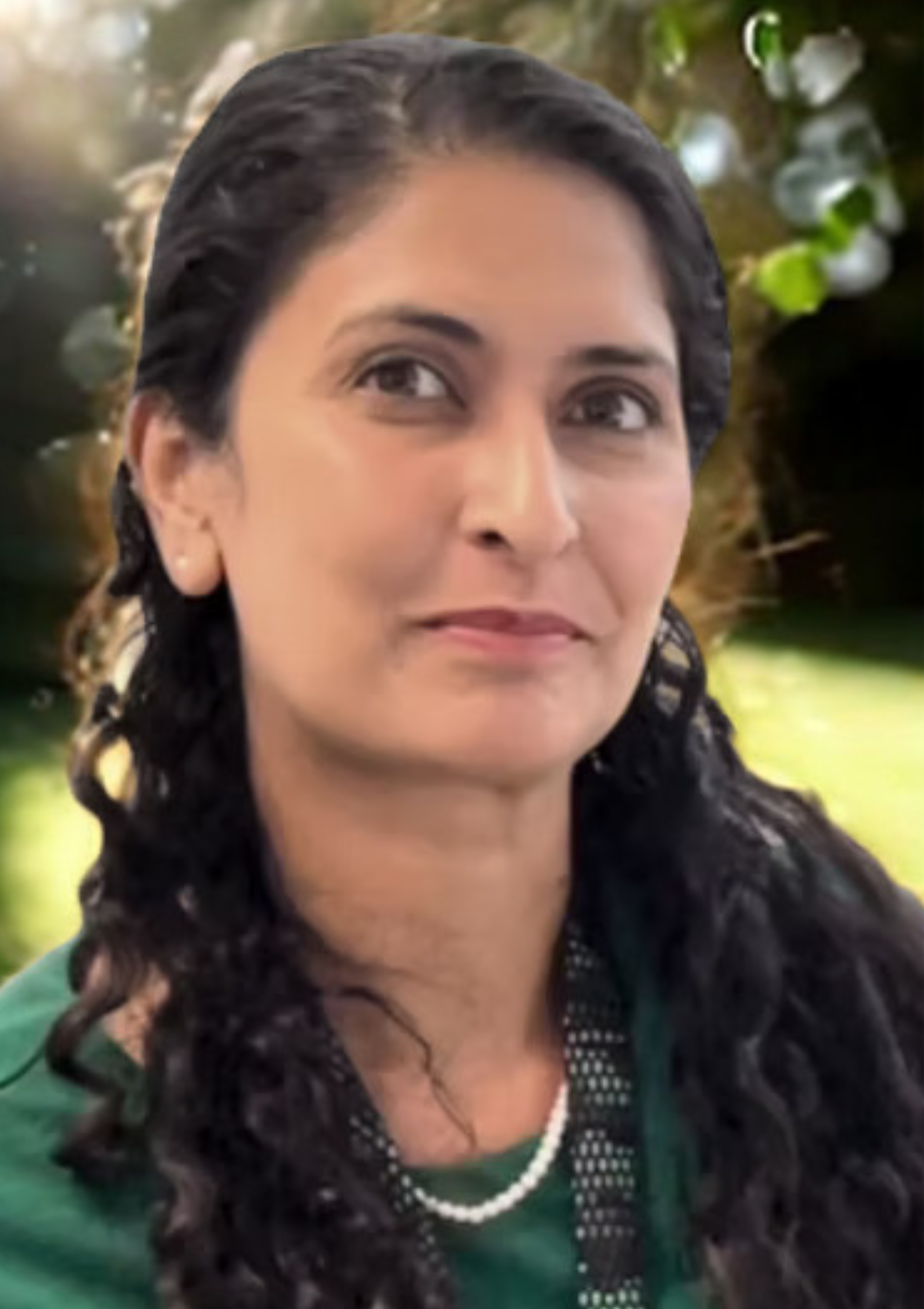 Headshot of Catherine Panayi, Clinical Psychologist, standing outdoors looking at the camera