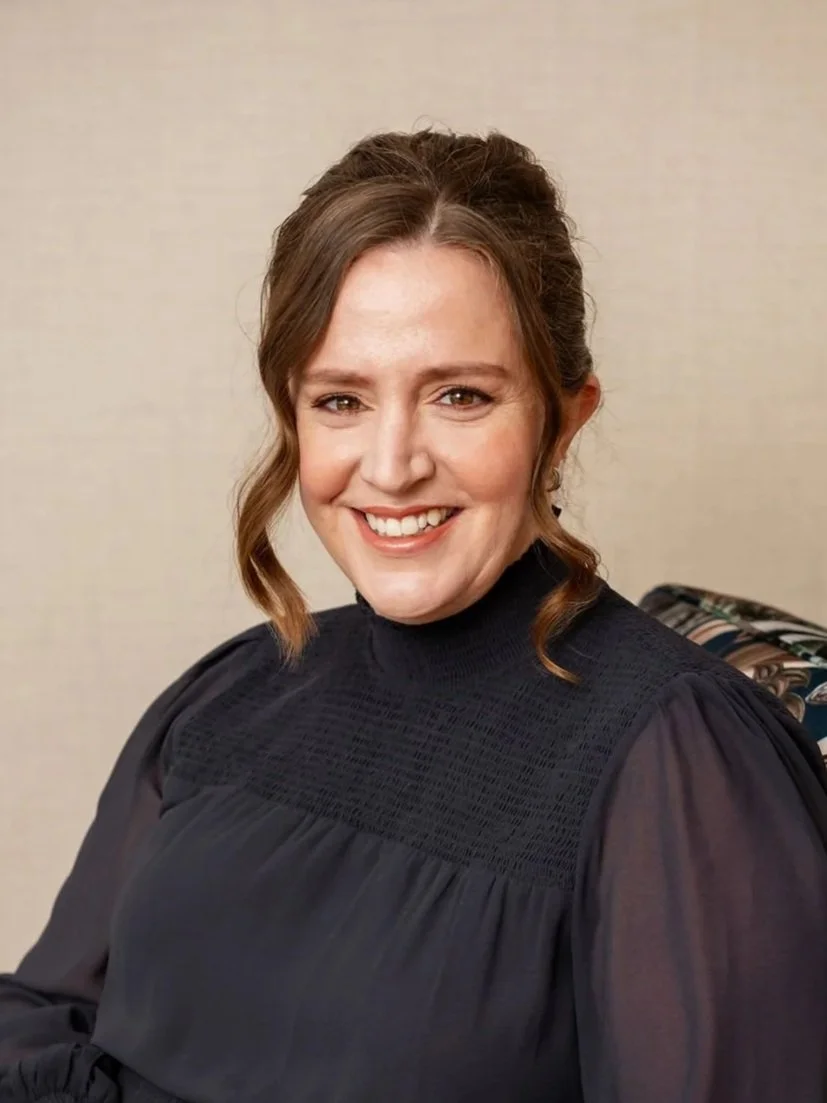Headshot of Julianne Rose, seated