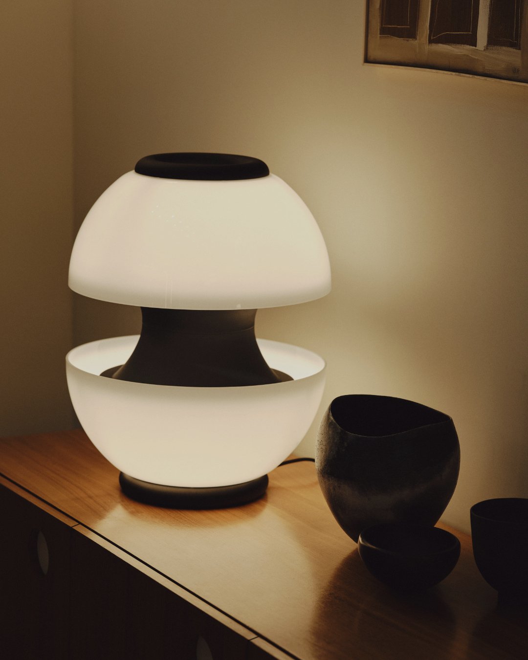 Light, composed in symmetry.⁠
⁠
In the Cupolla Double Table Light, balance becomes atmosphere.The twin opal forms radiate calm.⁠
⁠
Its presence is architectural yet intimate.  A piece that anchors without overpowering and that feels as considered as 