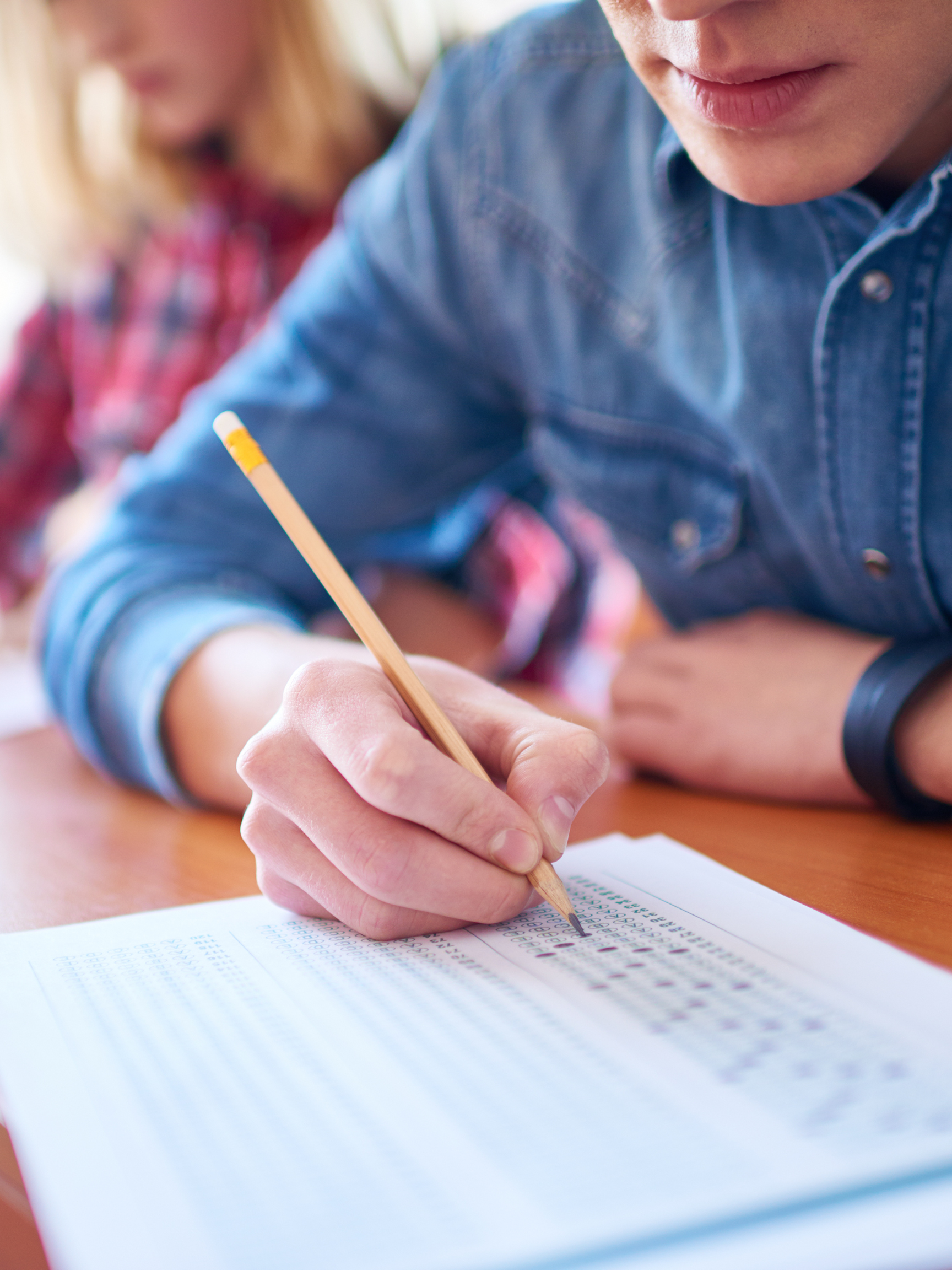A student fills in answers on a standardized test.