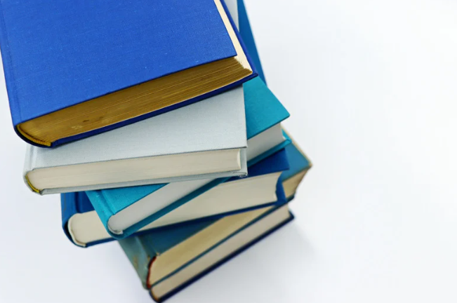 A stack of blue and white books.