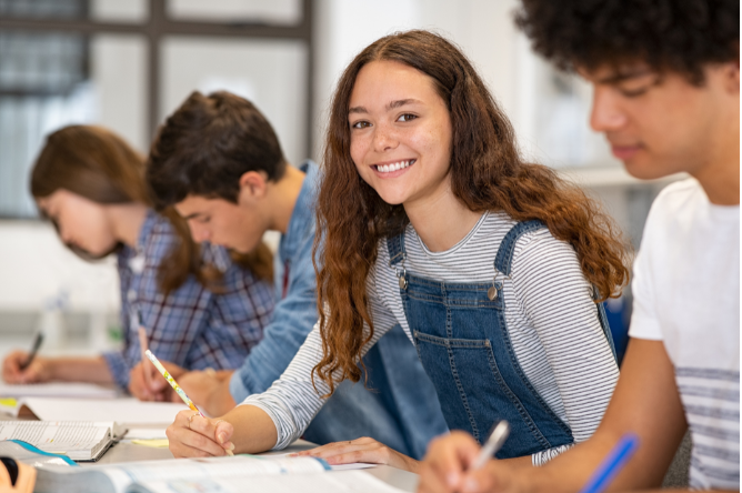 Happy student in CPS HSAT test prep program with tutoring for selective enrollment high schools in Chicago.