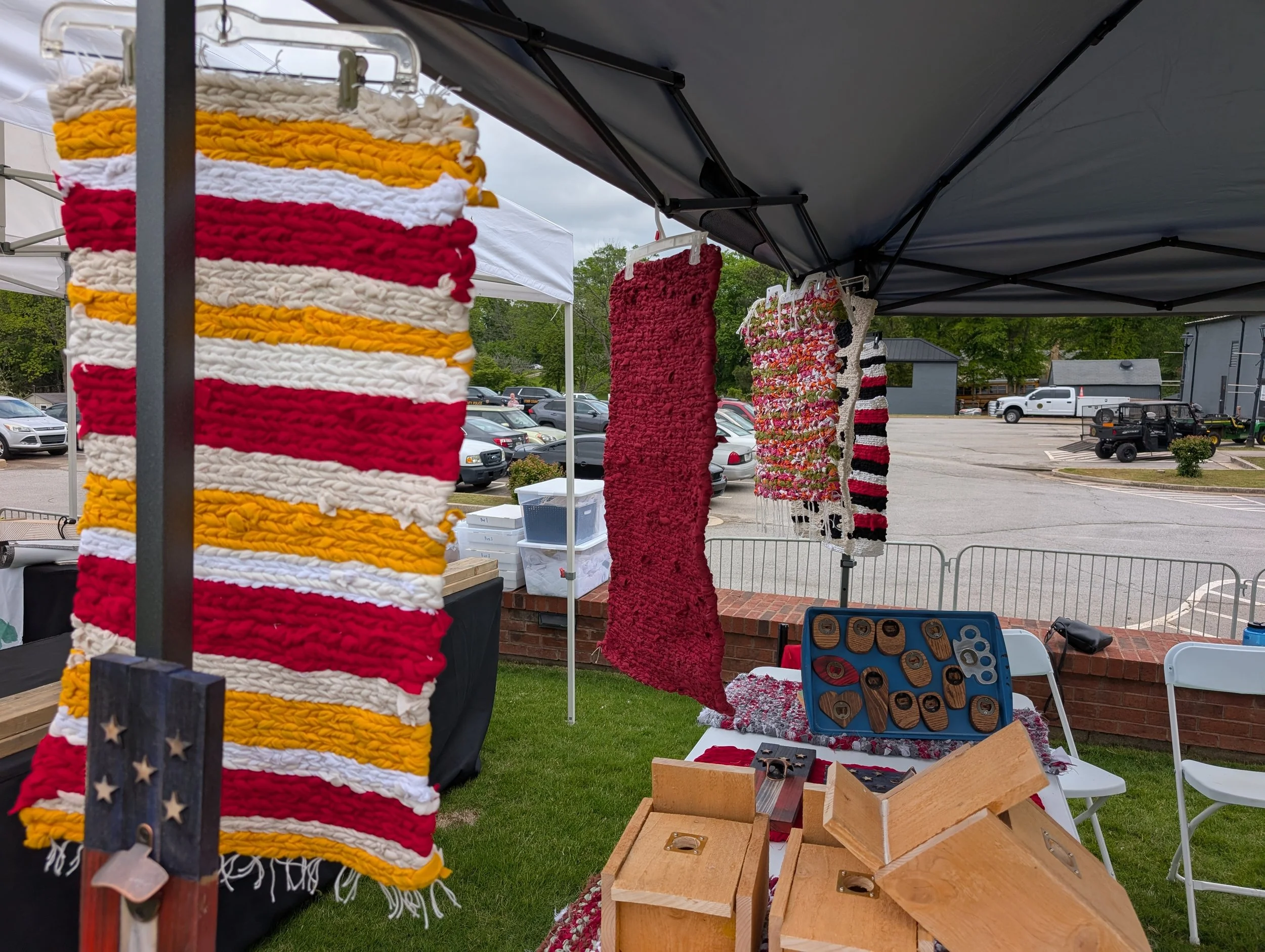 Handmade woven rugs in various colors  at the Villa Rica Art & Soul Festival