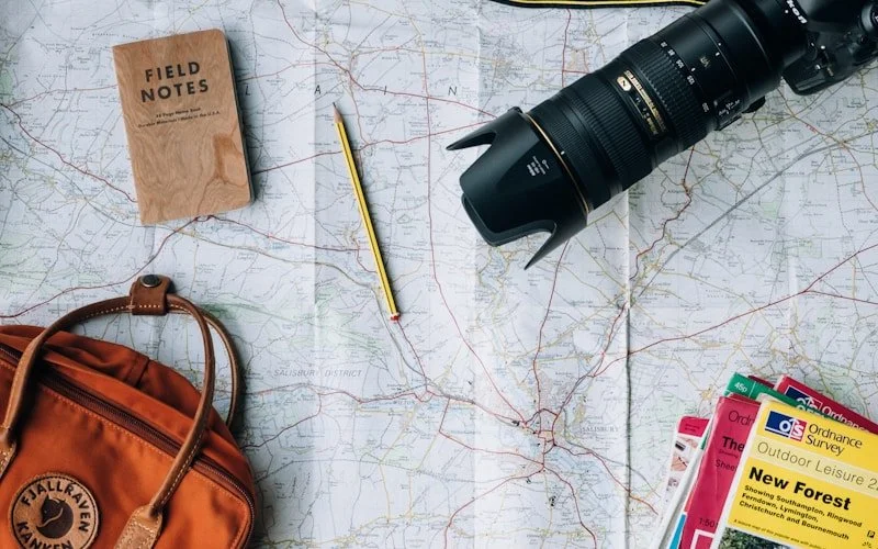 Map, cameras, field notes for planning