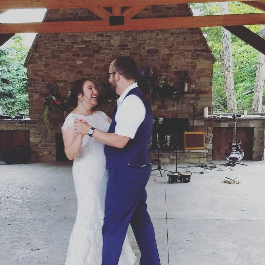Two people dancing at their wedding