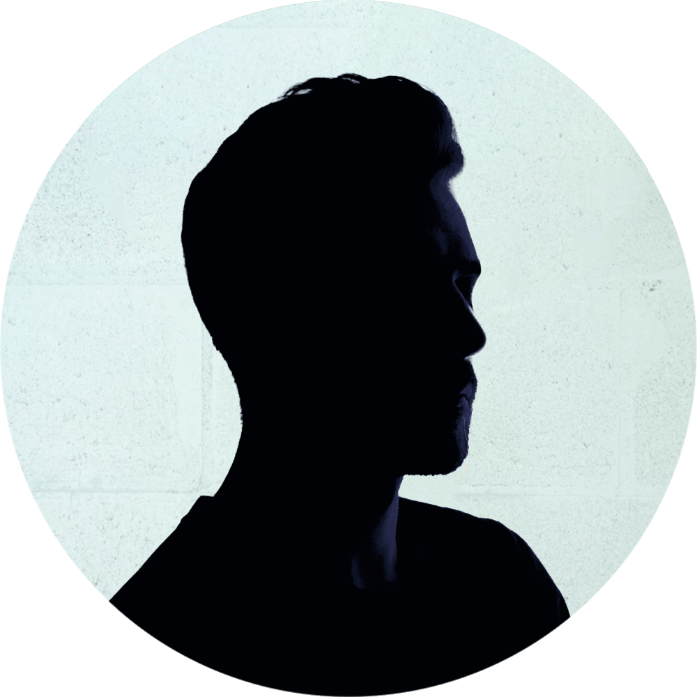 Silhouette of a man's profile with a light background.